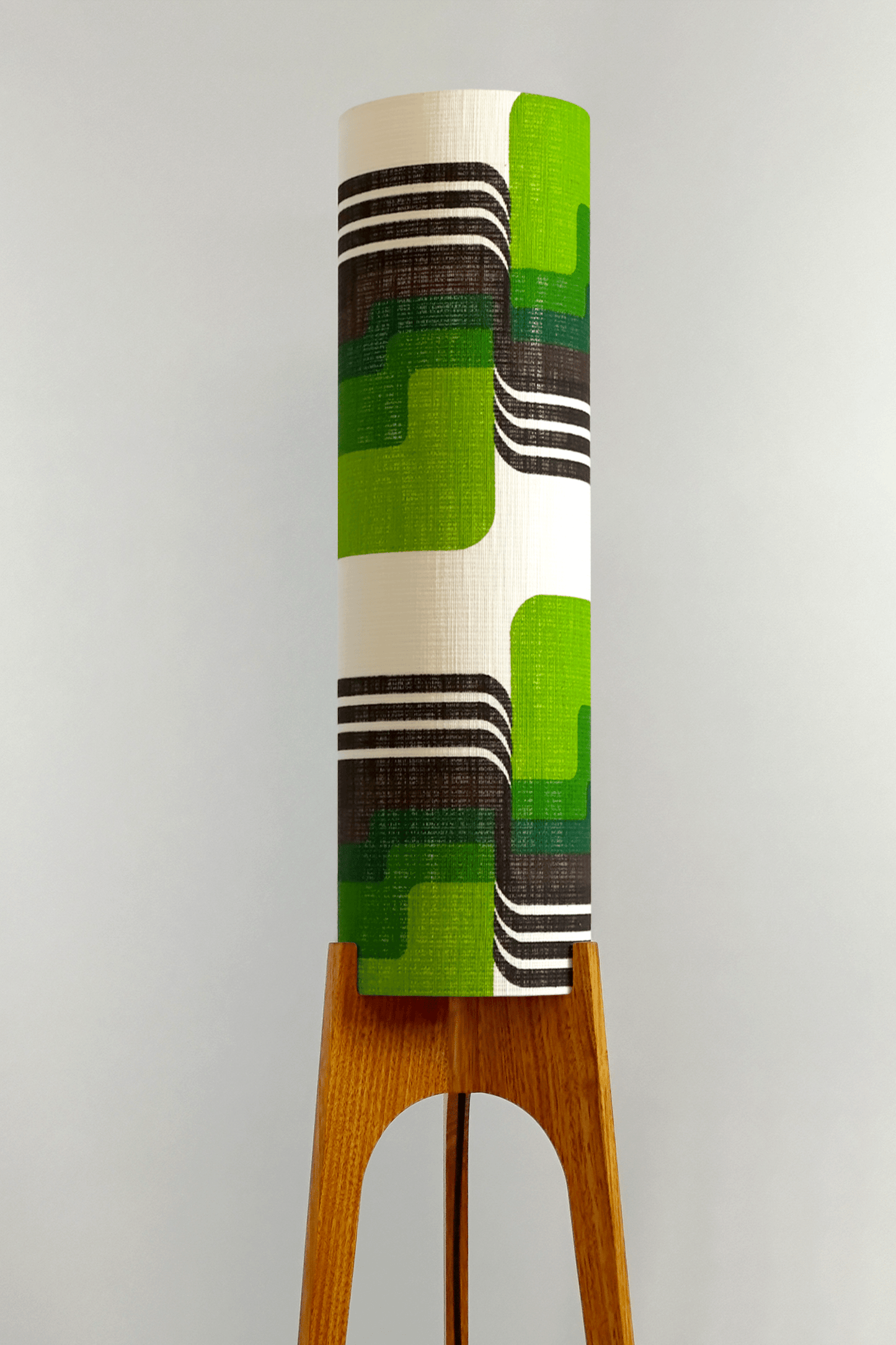 Fern - Archie Rocket floor lamp with handmade wooden base and handcrafted lampshade from vintage fabric with retro geometric patterns in green, brown, and white.
