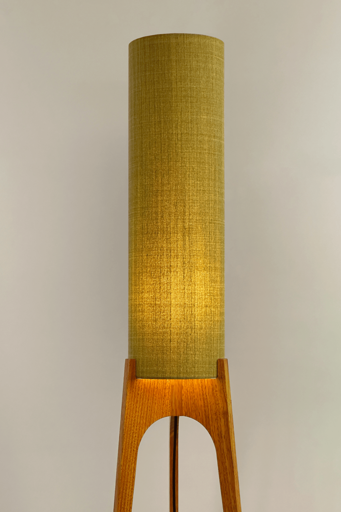 Archie Rocket Floor lamp with a lemongrass cylindrical shade and wooden base on a plain background