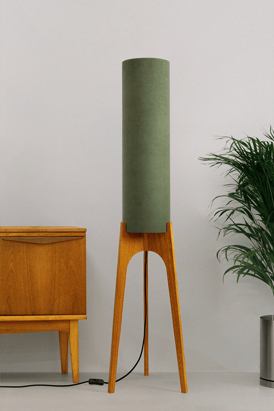 Handmade wooden Rocket Floor Lamp with cylindrical lampshade in Olive and wooden base in a mid-century room setting
