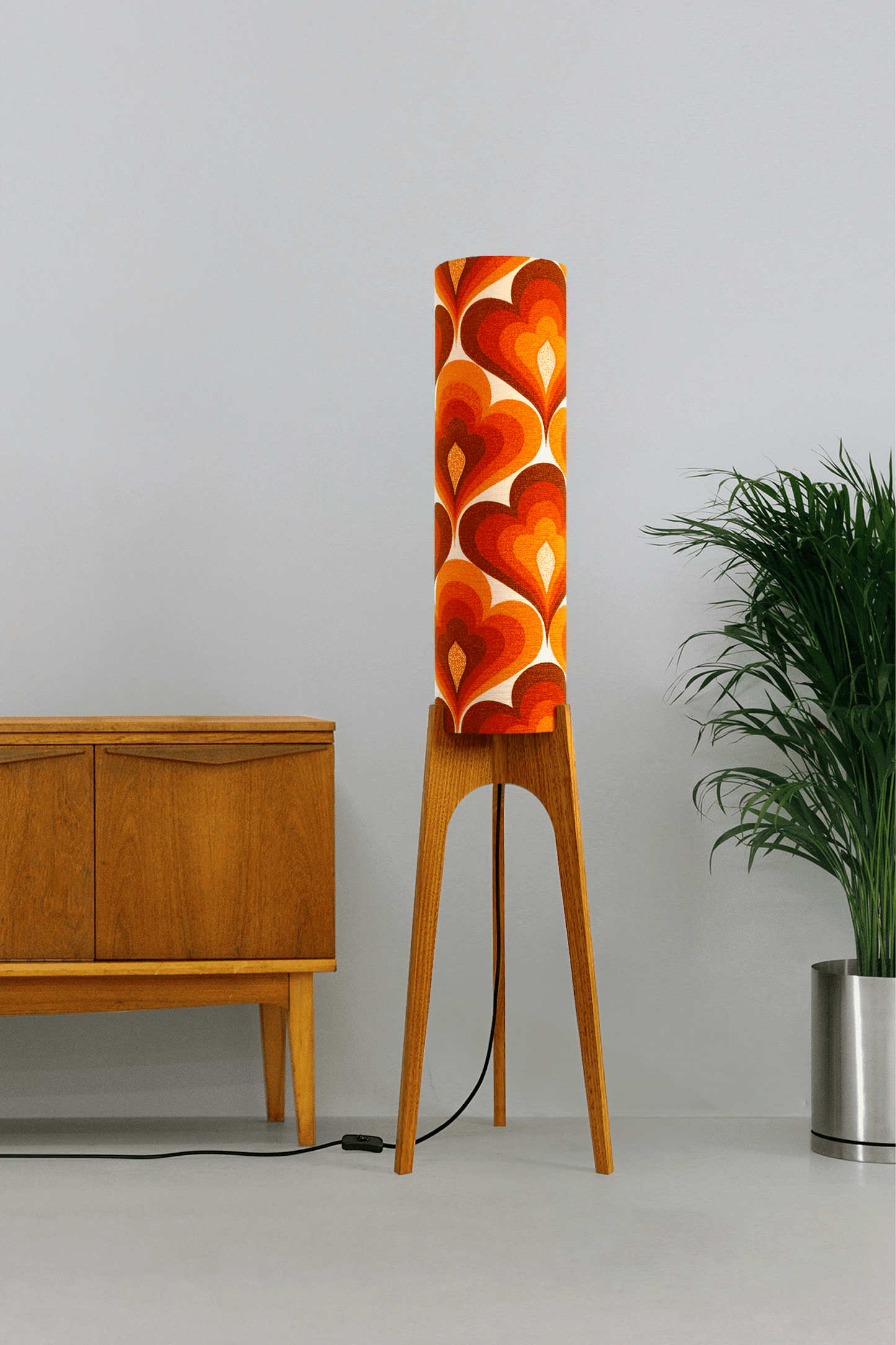 70s Love - Archie Rocket floor lamp with a vibrant orange and red heart-patterned shade made with authentic vintage fabric