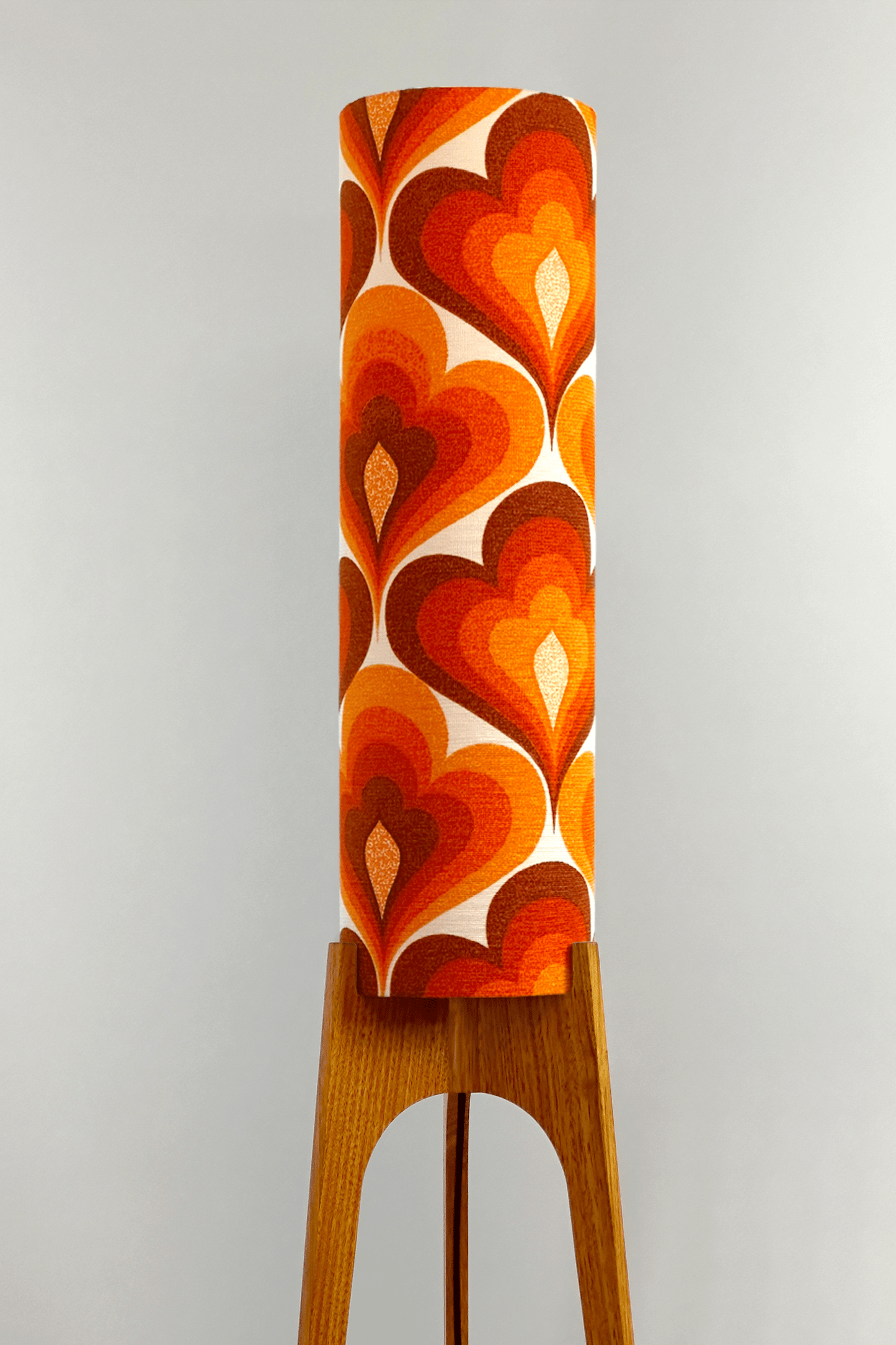 70s Love - Archie Rocket floor lamp with a vibrant orange and red heart-patterned shade made with authentic vintage fabric