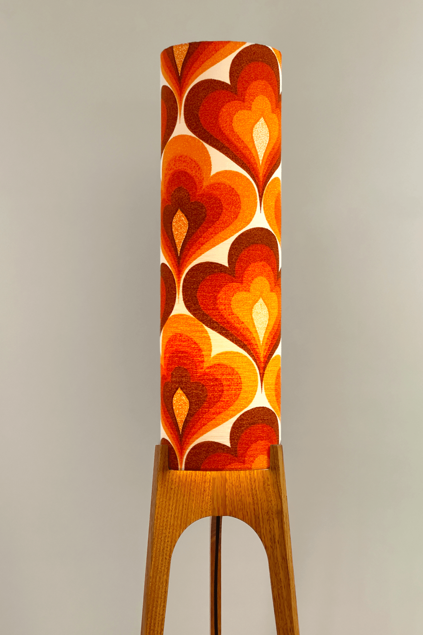 70s Love - Archie Rocket floor lamp with a vibrant orange and red heart-patterned shade made with authentic vintage fabric