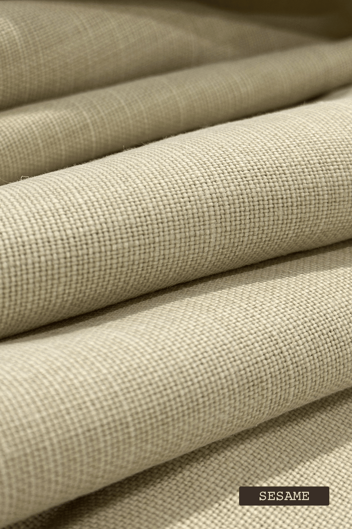 Close-up of linen fabric swatches with 'SESAME' label