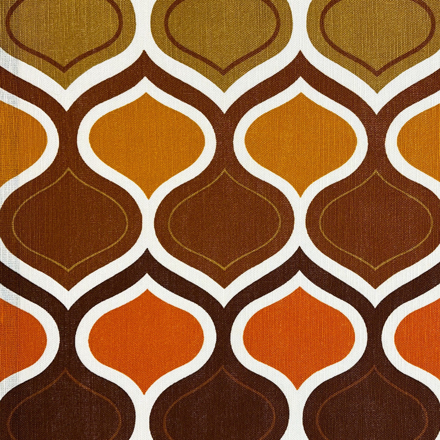 Patterned fabric with geometric design in brown, orange, and white on a black background