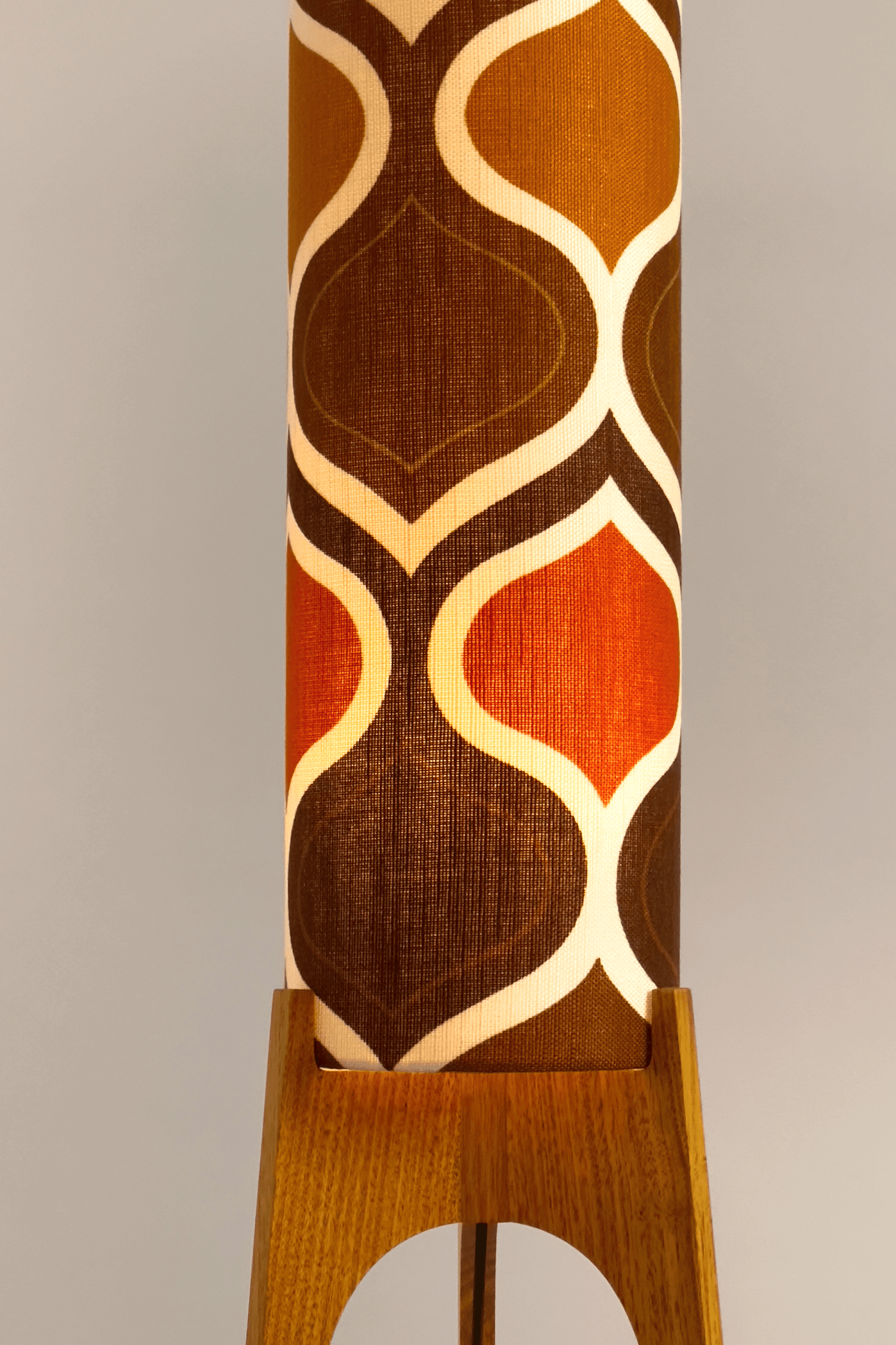 The Tangerine Archie Rocket Floor Lamp is a playful nod to the geometric patterns of the 1970s. Handcrafted from authentic vintage fabric and hardwood oak with a patterned shade in Mustard, Brown and Olive