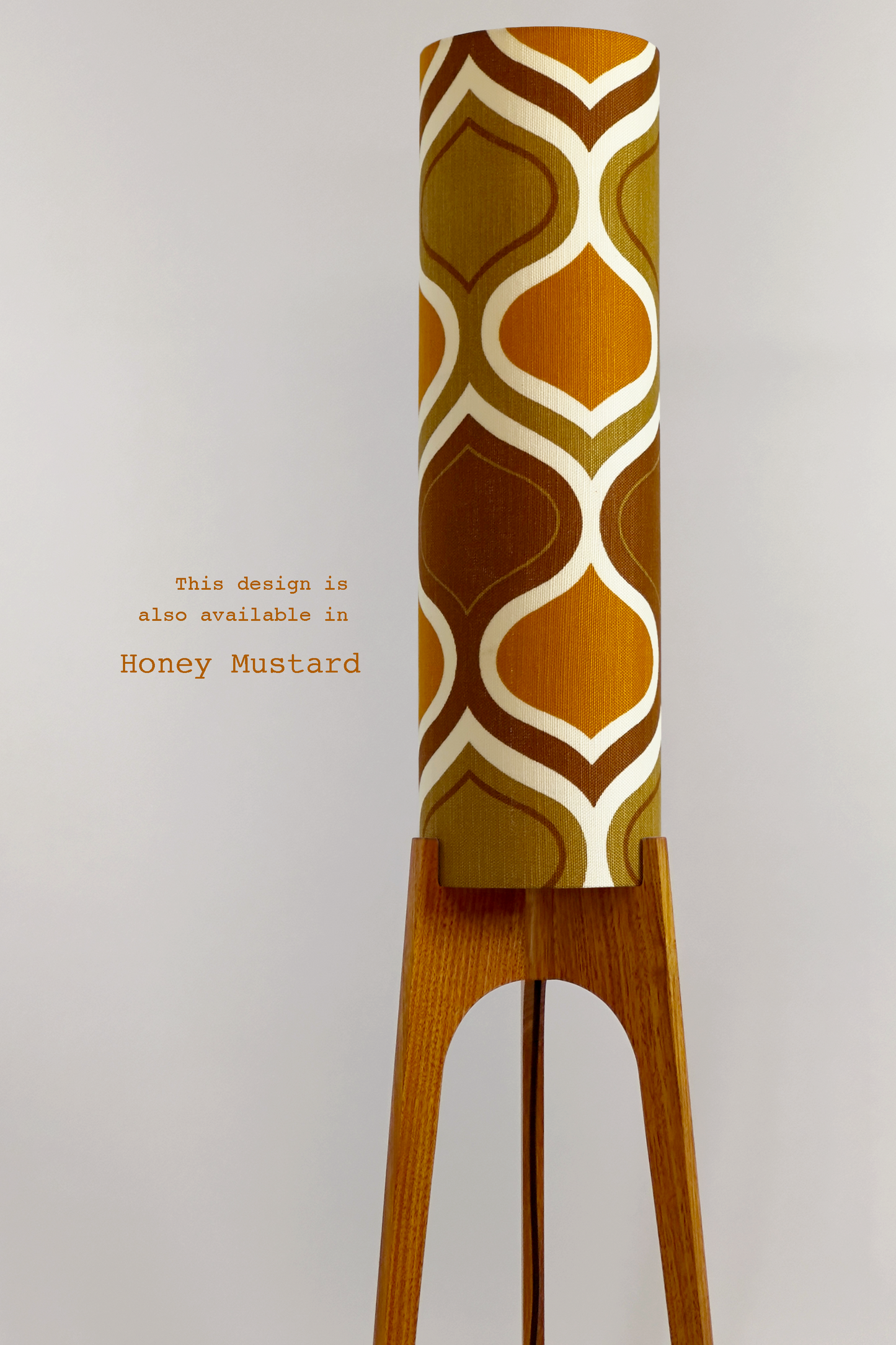 The Mustard Archie Rocket Floor Lamp is a playful nod to the geometric patterns of the 1970s. Handcrafted from authentic vintage fabric and hardwood oak with a patterned shade in Mustard, Brown and Olive
