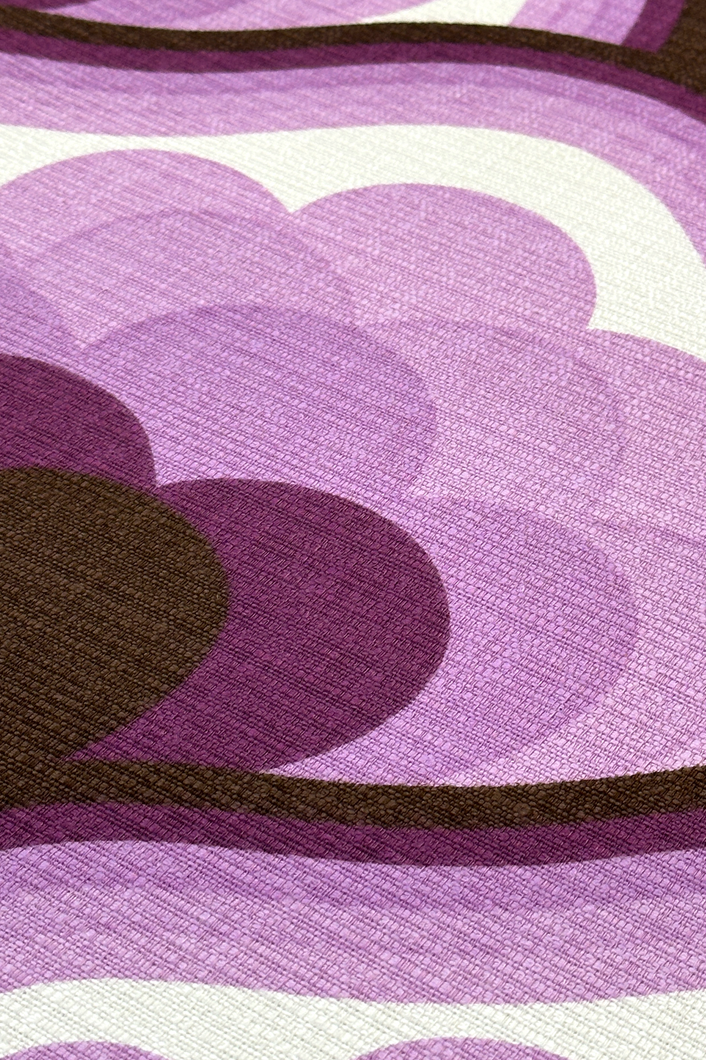 Viola - Close-up of viola vintage fabric with purple, brown, and white geometric pattern