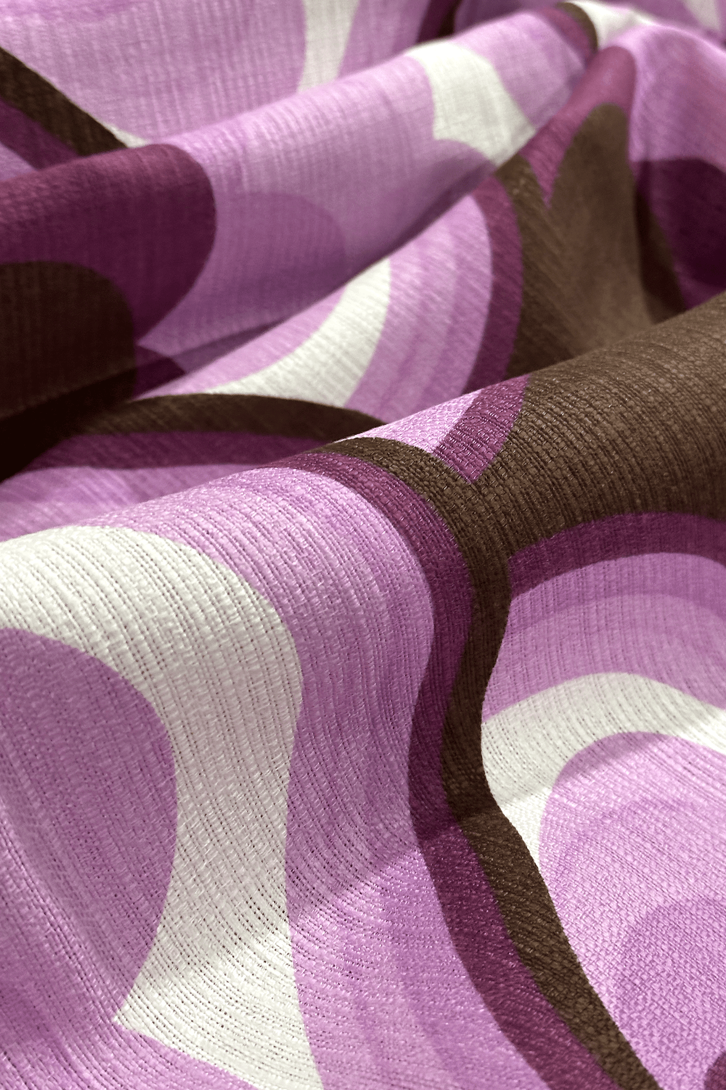 Viola - Close-up of viola vintage fabric with purple, brown, and white geometric pattern