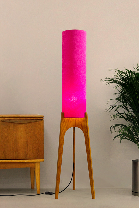 Pink Archie Rocket Floor Lamp made from recycled fabric and a wooden lamp base in a mid-modern century room.