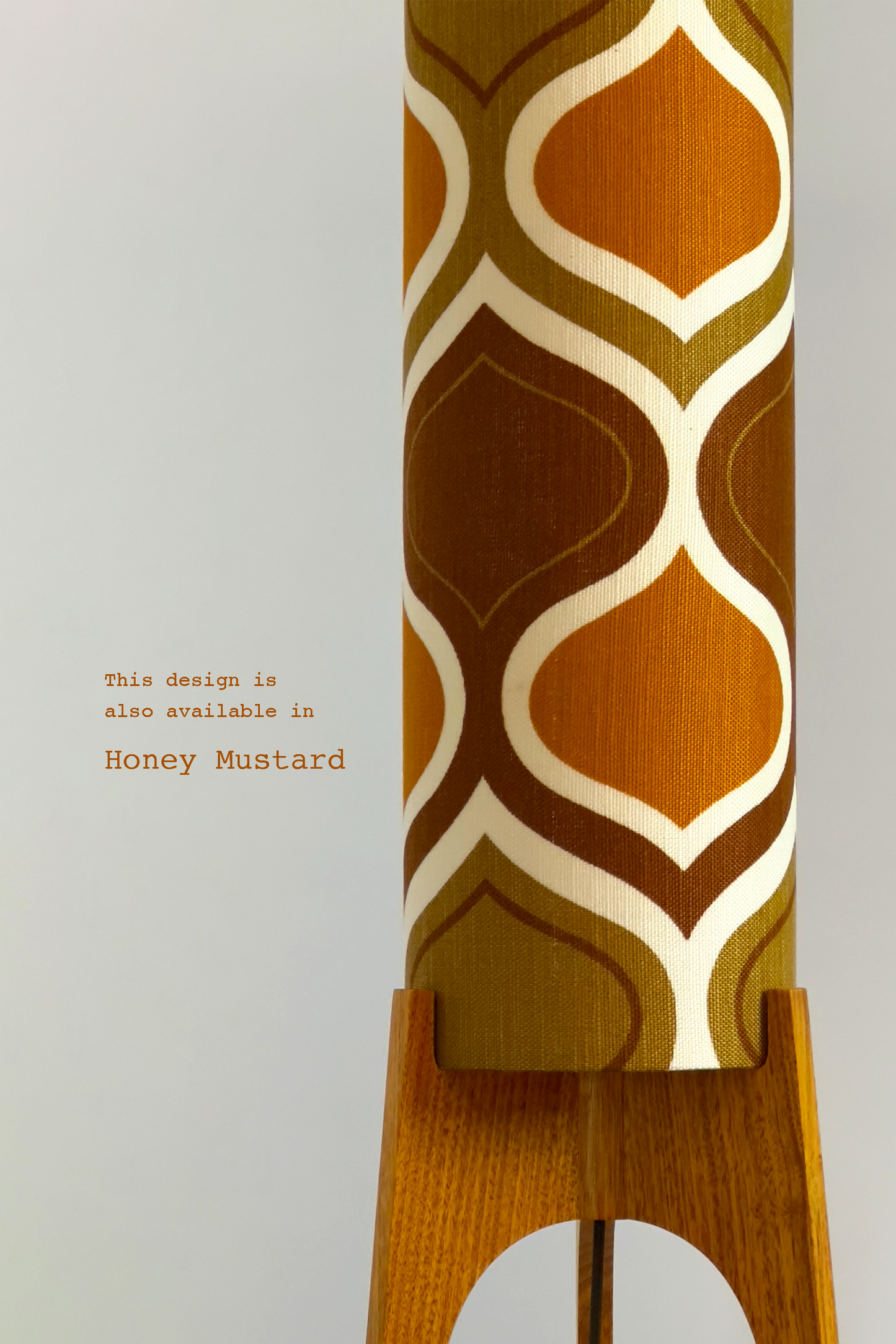 The Mustard Archie Rocket Floor Lamp is a playful nod to the geometric patterns of the 1970s. Handcrafted from authentic vintage fabric and hardwood oak with a patterned shade in Mustard, Brown and Olive