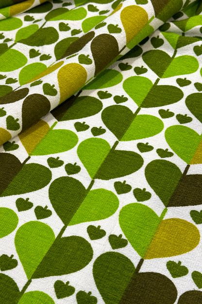 Alfie - authentic vintage geometric fabric with heart-like motif in shades of apple green, moss and warm forest green 