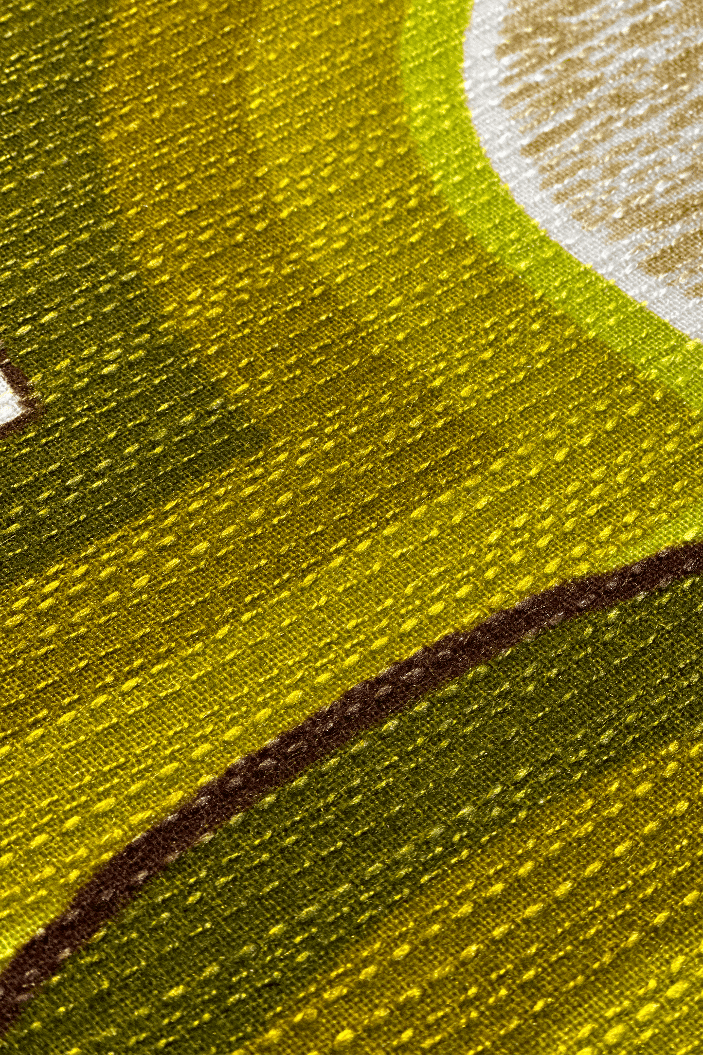 Close up of Asher vintage fabric with green and brown tones, and fabric textures