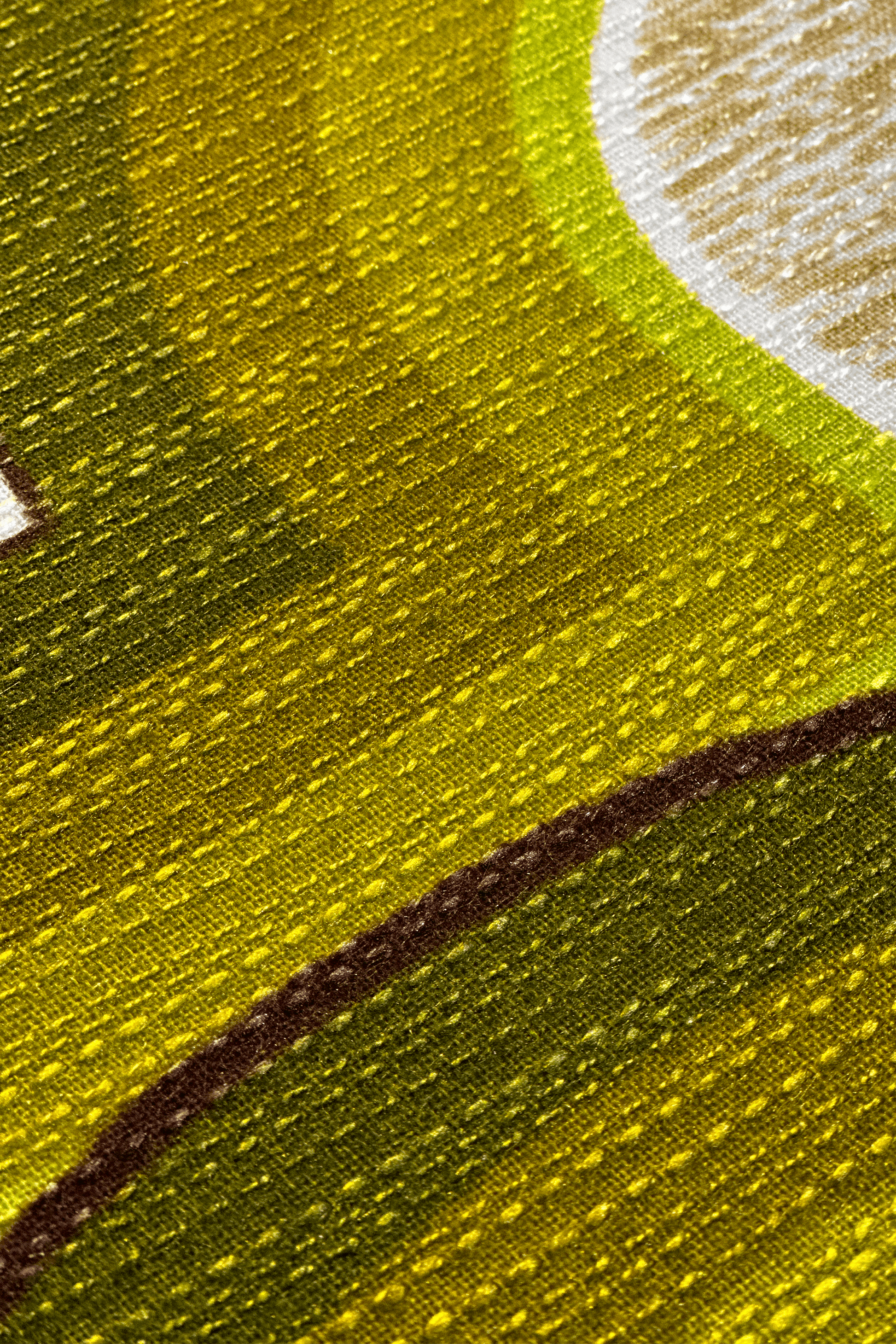 Close up of Asher vintage fabric with green and brown tones, and fabric textures