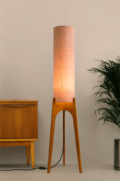 Blush Archie Rocket Wooden floor lamp with a cylindrical shade on a neutral background