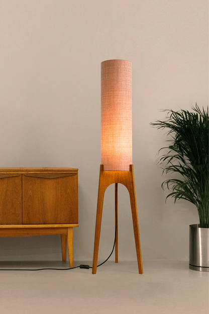 Blush Archie Rocket Wooden floor lamp with a cylindrical shade on a neutral background