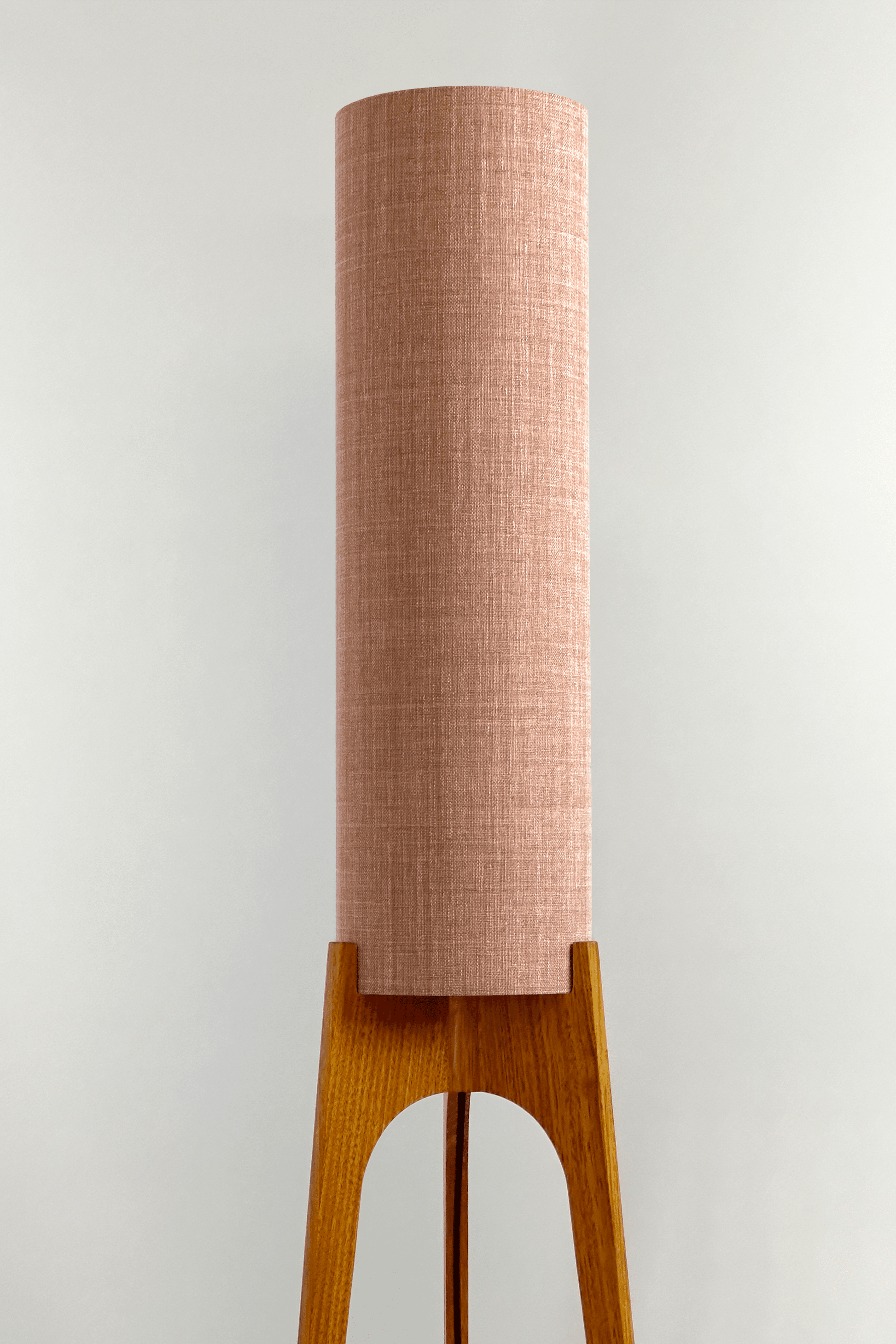 Blush Archie Rocket Wooden floor lamp with a cylindrical shade on a neutral background