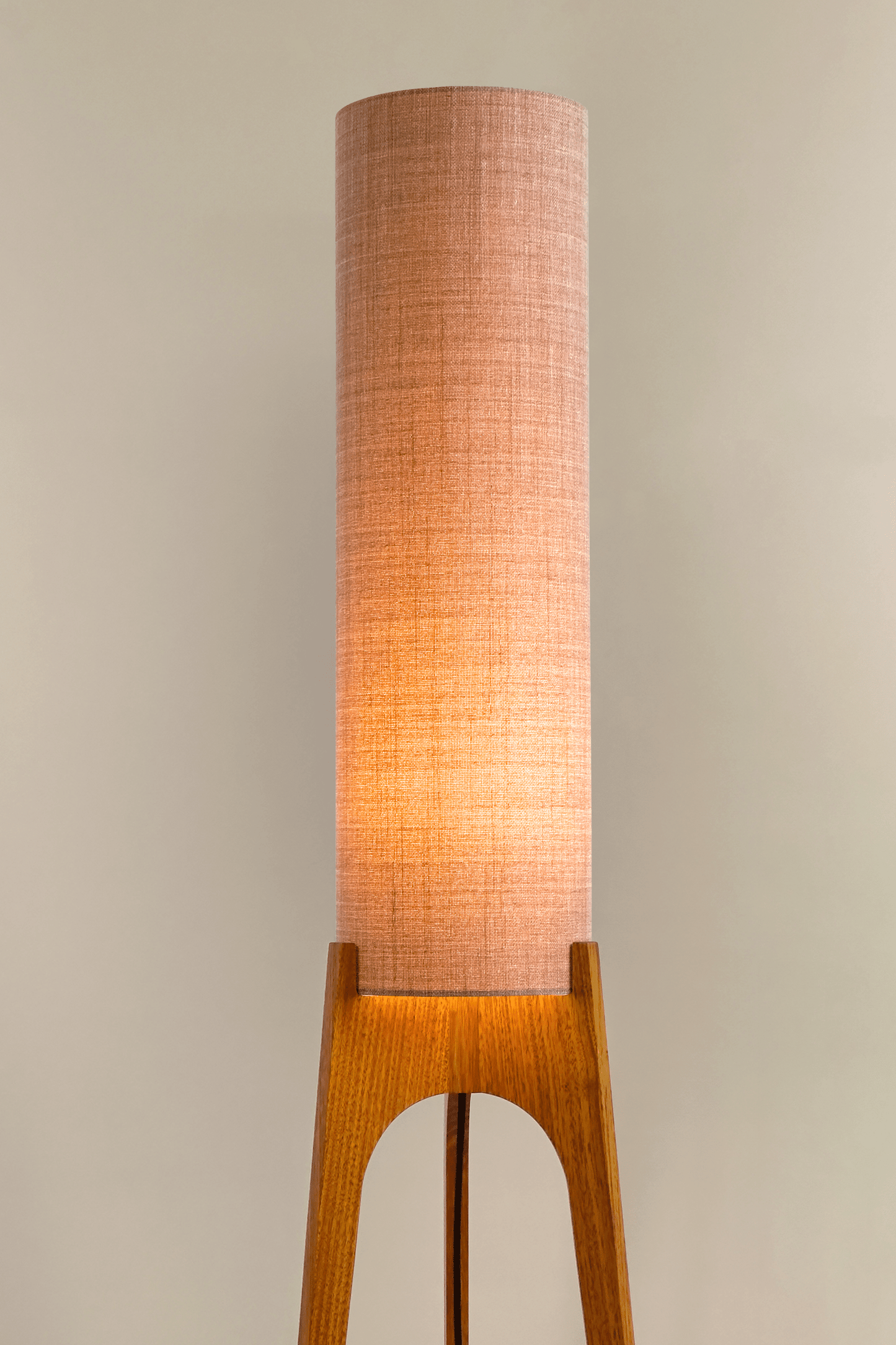 Blush Archie Rocket Wooden floor lamp with a cylindrical shade on a neutral background