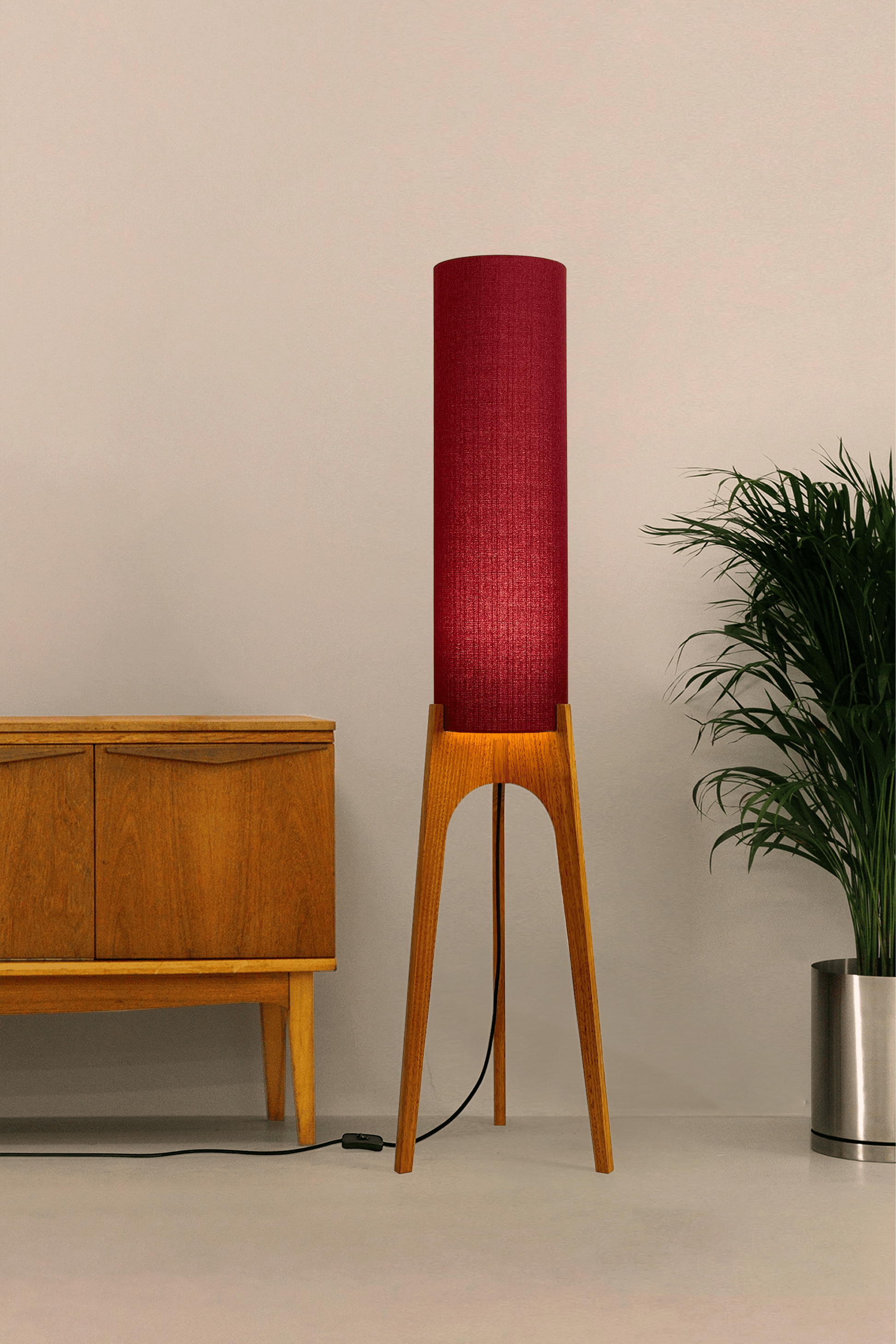 Wooden rocket floor lamp with a Burgundy cylindrical lampshade handmade from recycled fabric, on a neutral background