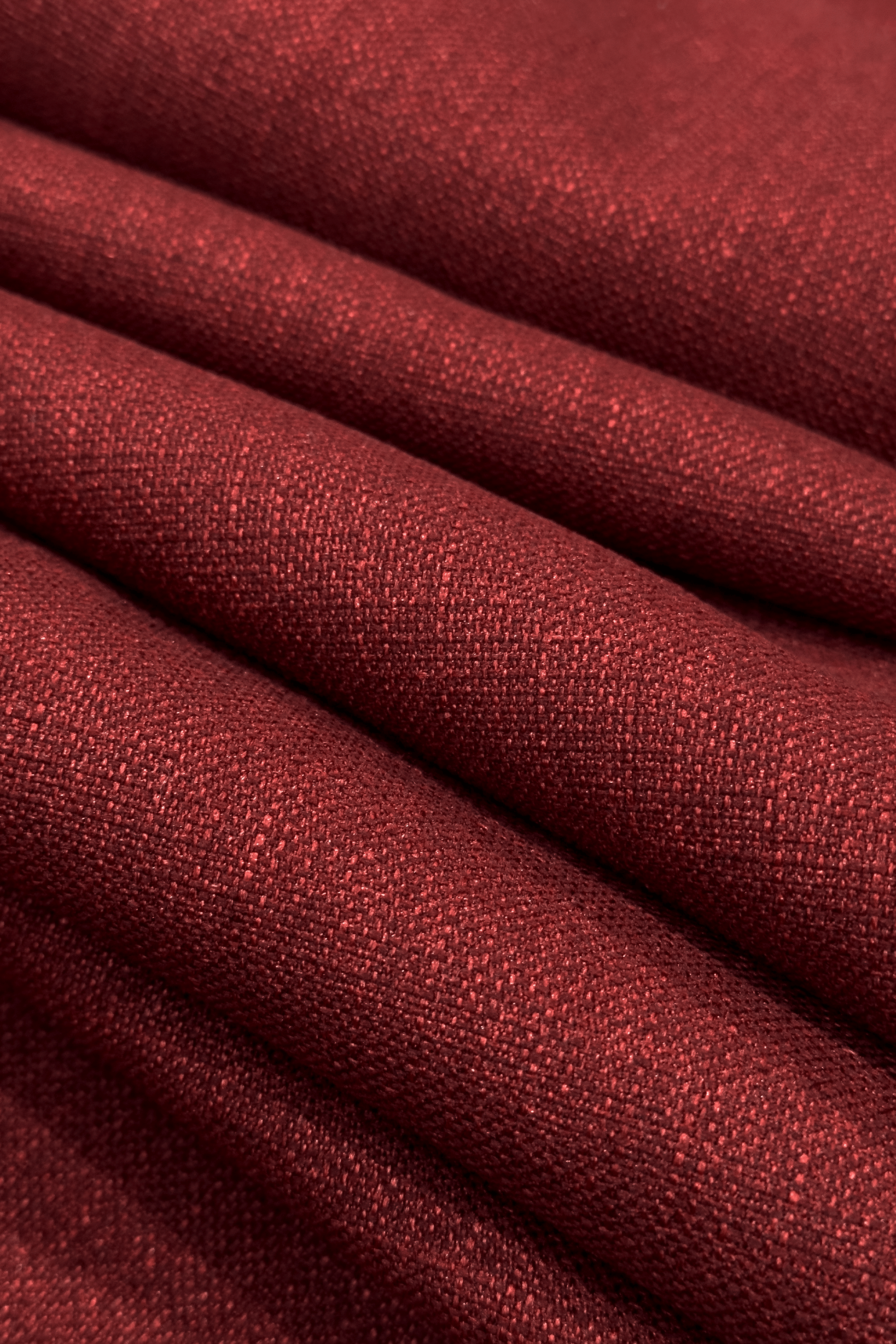 Close-up of red fabric with a textured pattern