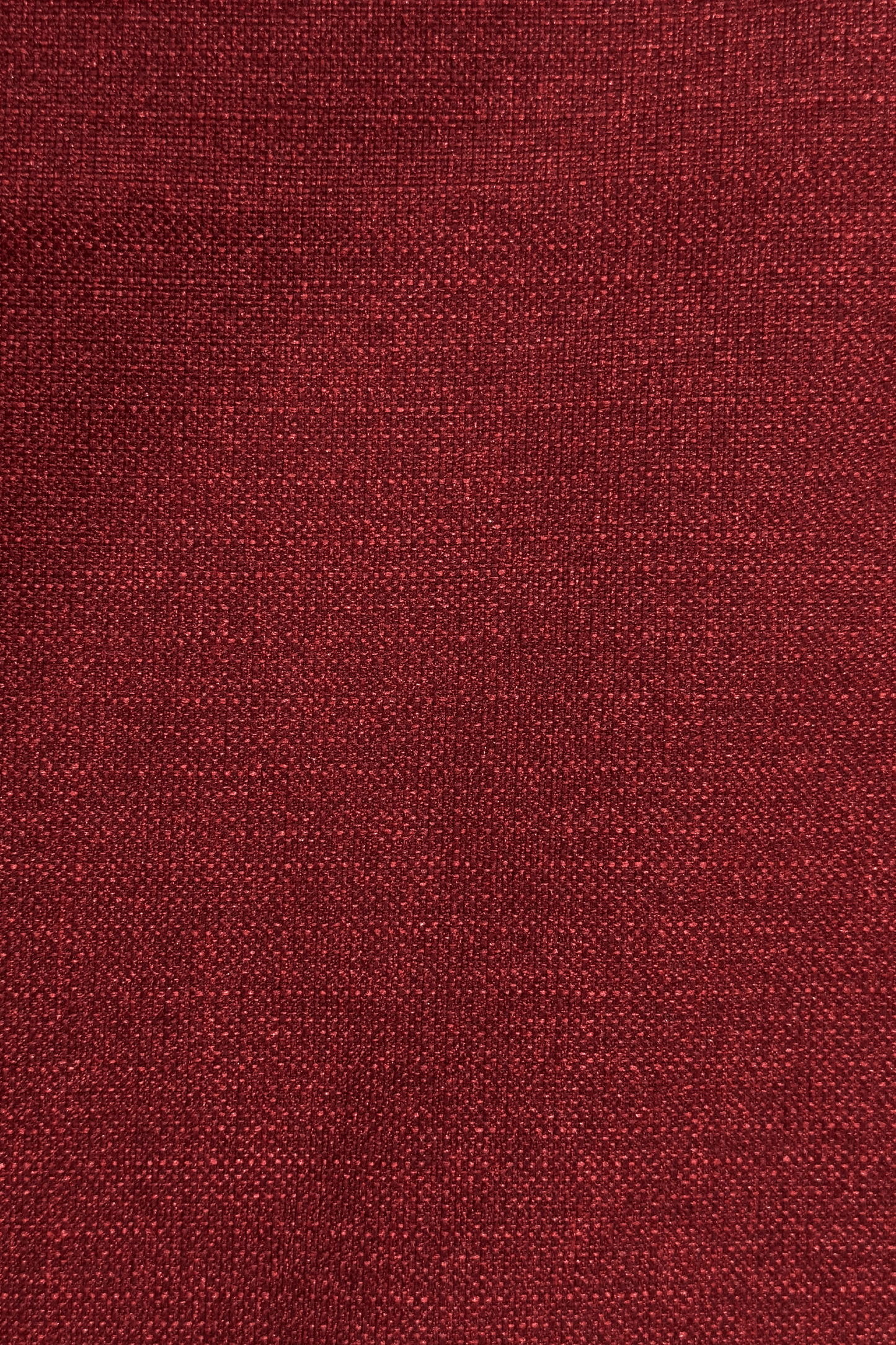 Close-up of a red burgundy textured red fabric surface