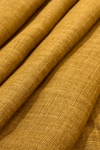 Close-up of folded premium linen fabric in Camel colour tones