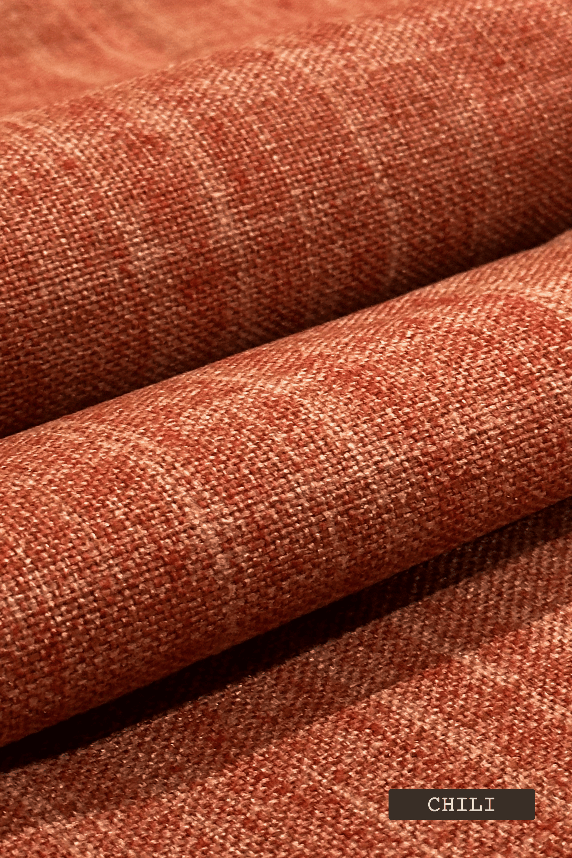 Close-up of green fabric with 'Chili' label