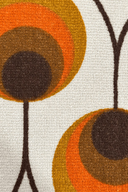 a vintage geometric patterned fabric shade in orange and brown tones