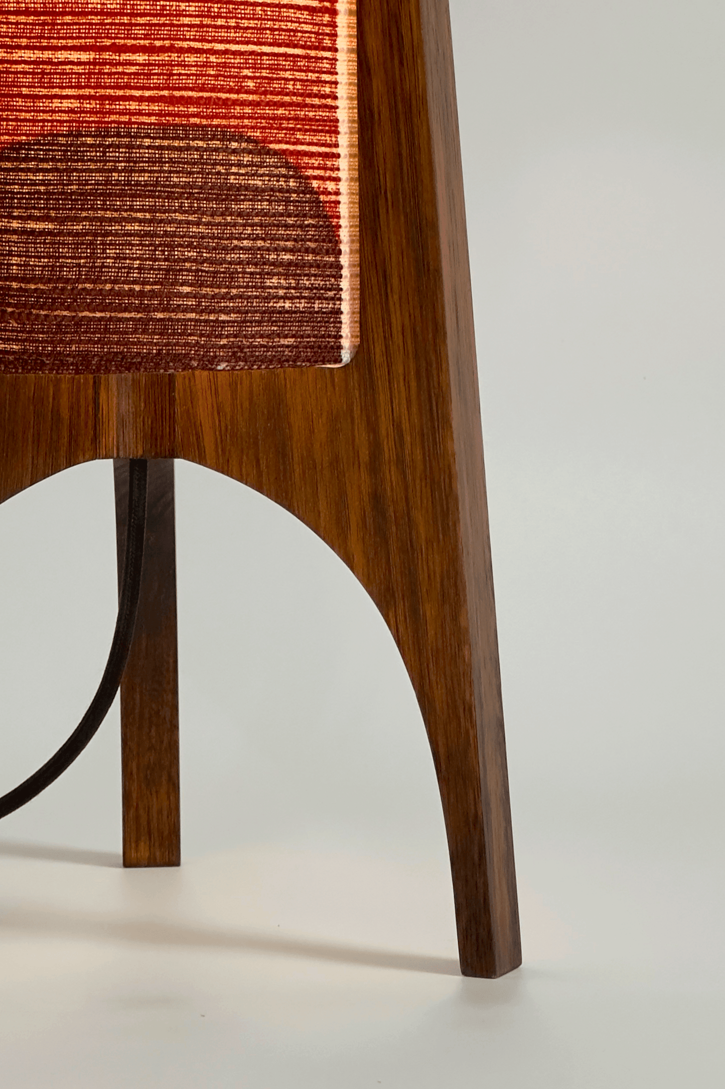 Dawn - Handcrafted Archie Rocket Table lamp with a vintage geometric patterned fabric shade in red and orange tones and wooden base