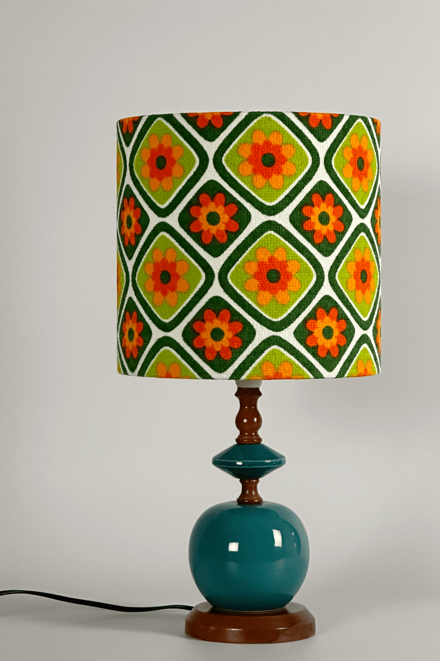 Emearld Bliss handmade lampshade with a colorful geometric pattern with a ceramic vintage lamp