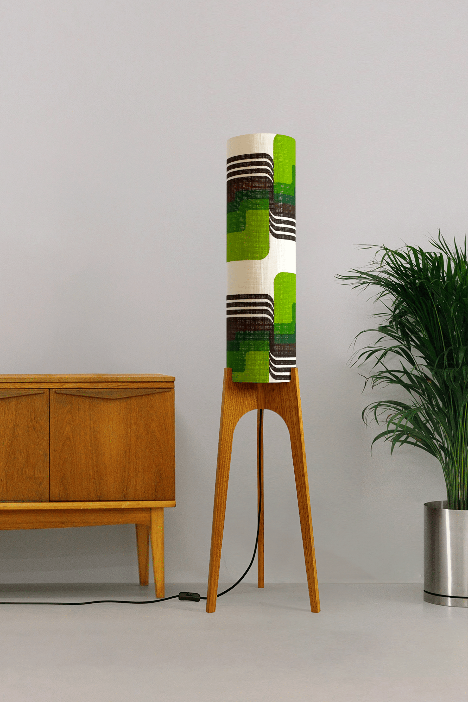 Fern - Archie Rocket floor lamp with handmade wooden base and handcrafted lampshade from vintage fabric with retro geometric patterns in green, brown, and white.