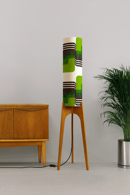 Fern - Archie Rocket floor lamp with handmade wooden base and handcrafted lampshade from vintage fabric with retro geometric patterns in green, brown, and white.