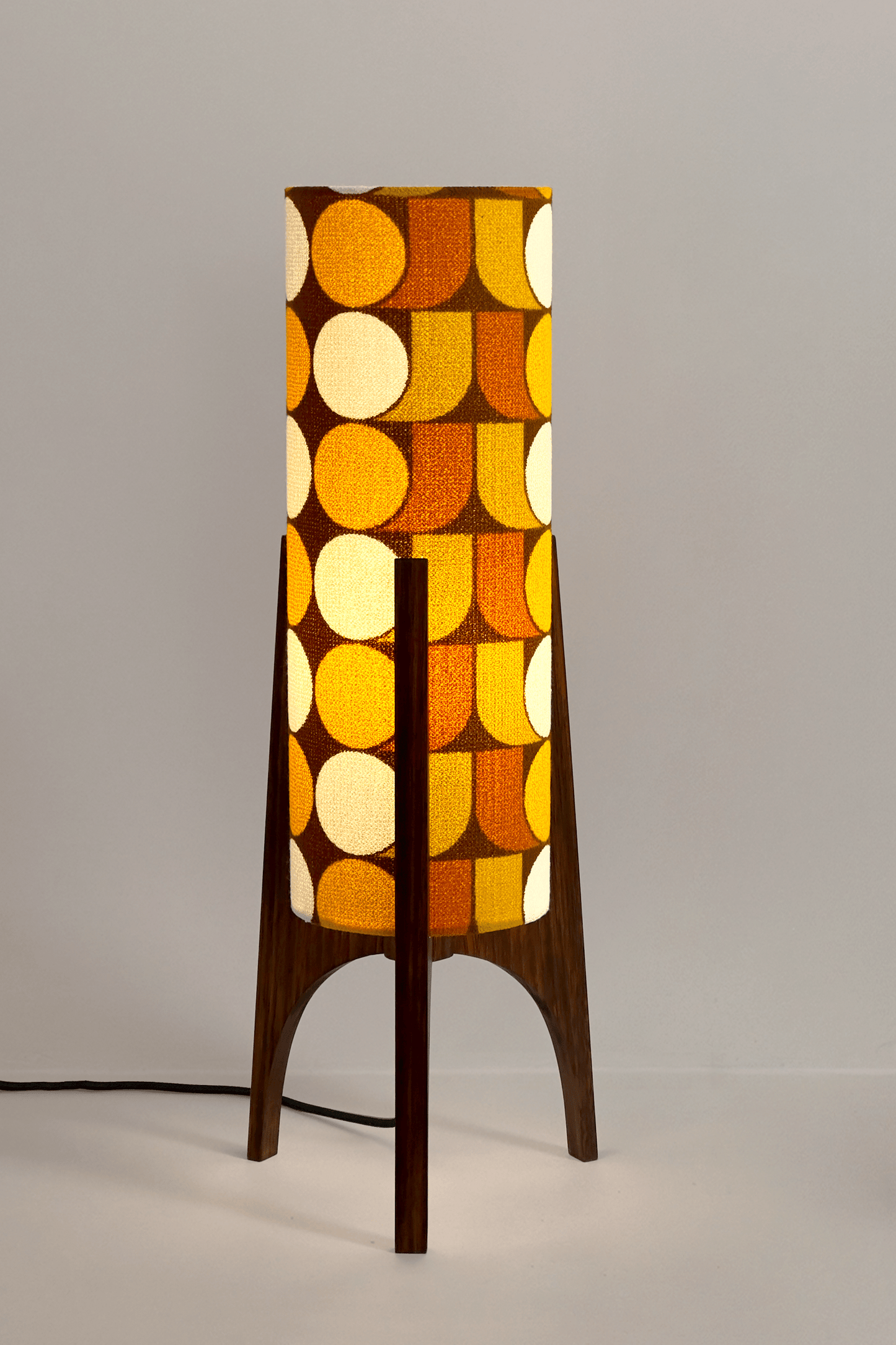 June - Handmade Archie Rocket Table lamp with a vintage geometric patterned fabric shade in yellow, brown and mustard tones, paired with a wooden base