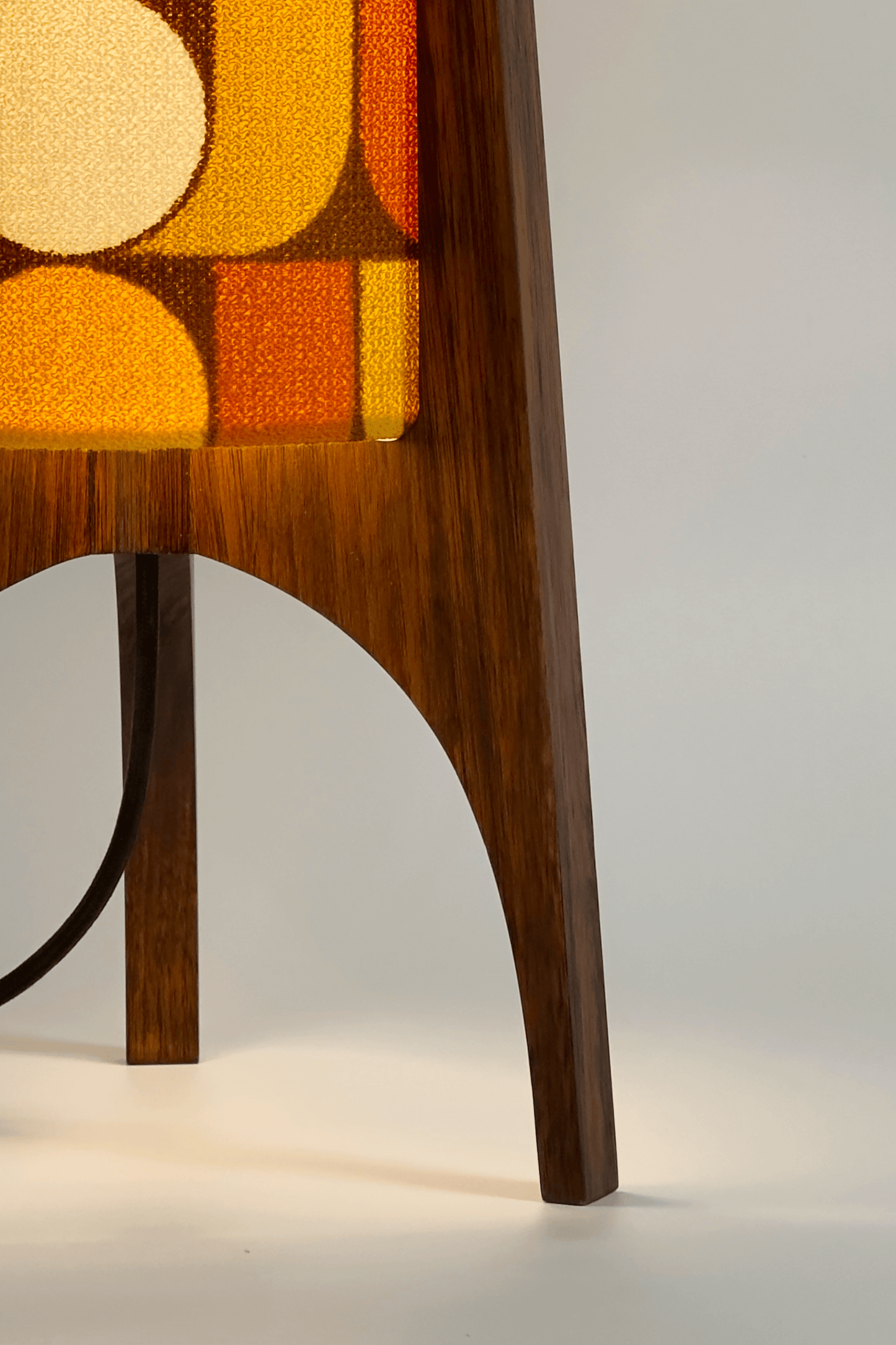 June - Handmade Archie Rocket Table lamp with a vintage geometric patterned fabric shade in yellow, brown and mustard tones, paired with a wooden base