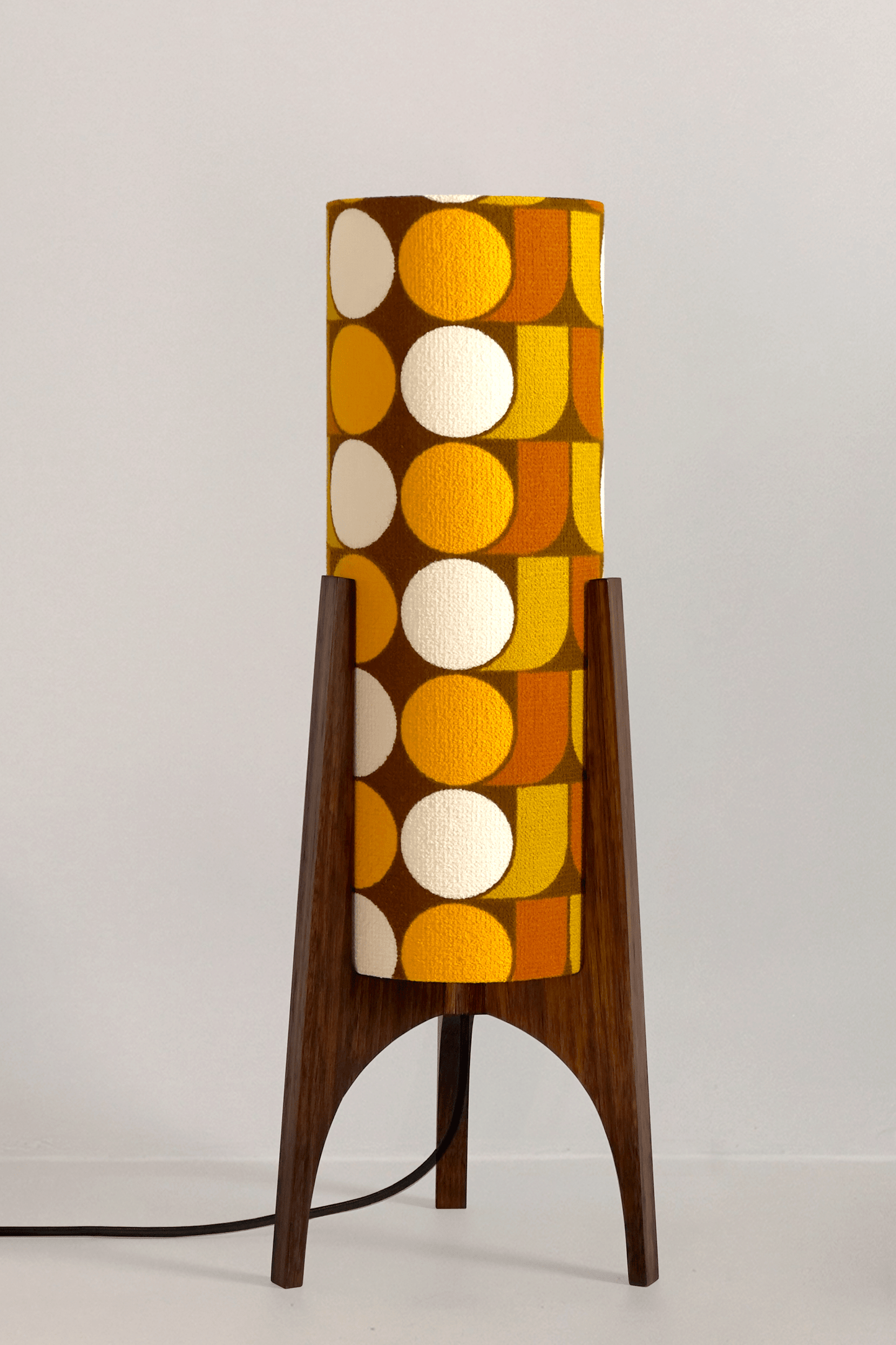 June - Handmade Archie Rocket Table lamp with a vintage geometric patterned fabric shade in yellow, brown and mustard tones, paired with a wooden base