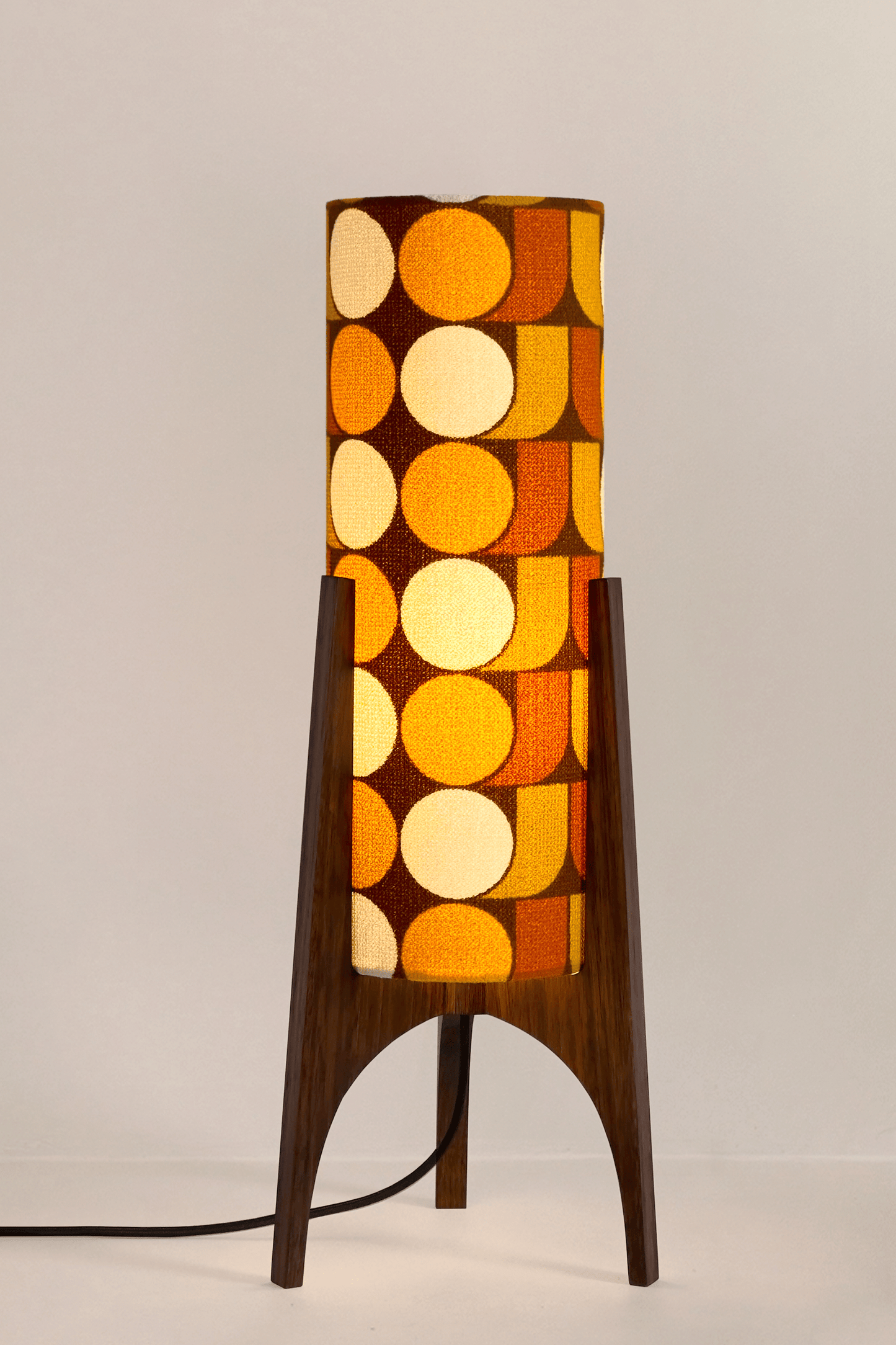 June - Handmade Archie Rocket Table lamp with a vintage geometric patterned fabric shade in yellow, brown and mustard tones, paired with a wooden base