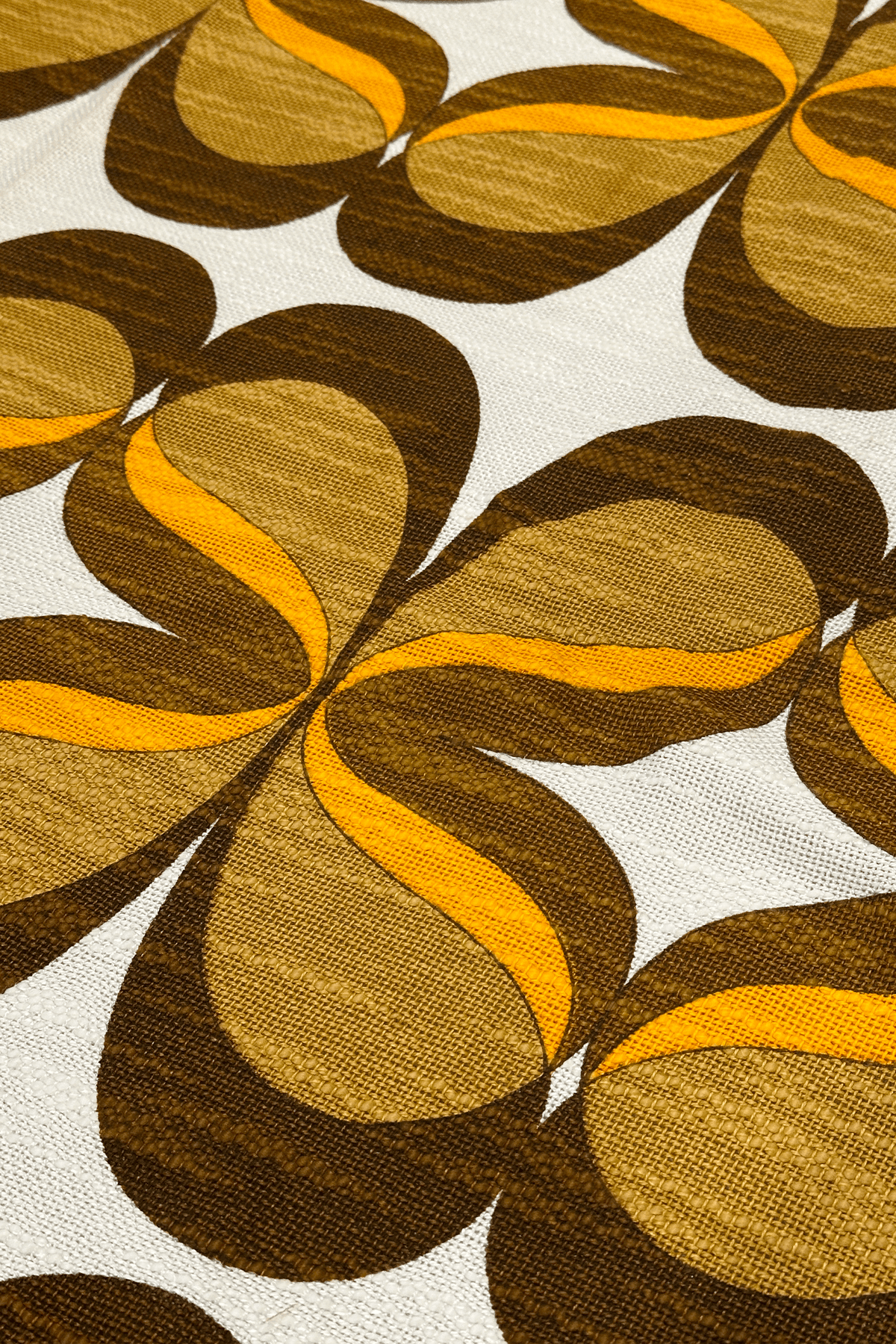 authentic 1970s vintage woven fabric, featuring a flowing retro pattern in chocolate brown, caramel and orange.