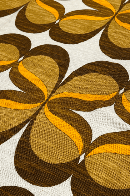 authentic 1970s vintage woven fabric, featuring a flowing retro pattern in chocolate brown, caramel and orange.