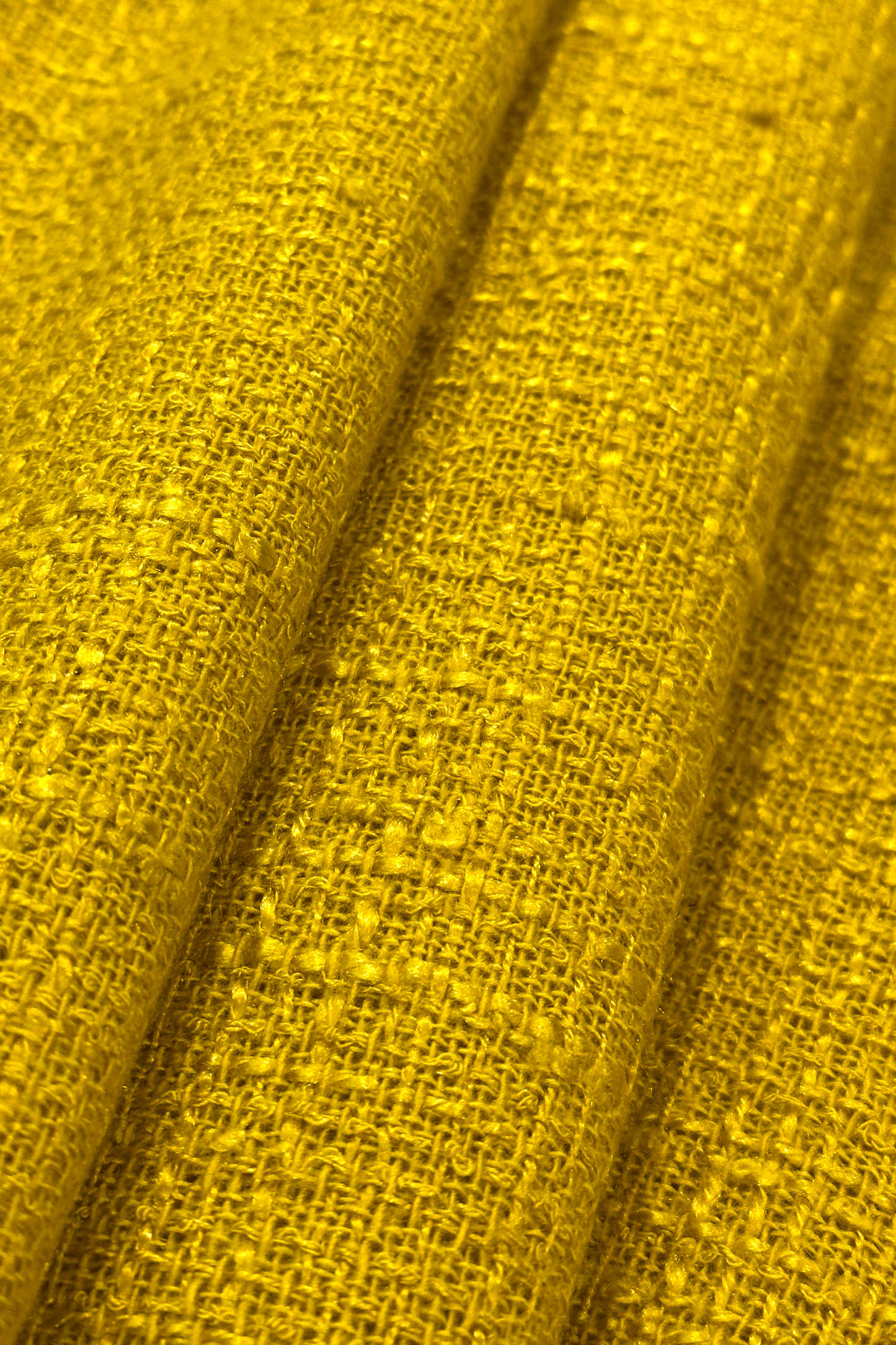 Close-up of textured yellow fabric