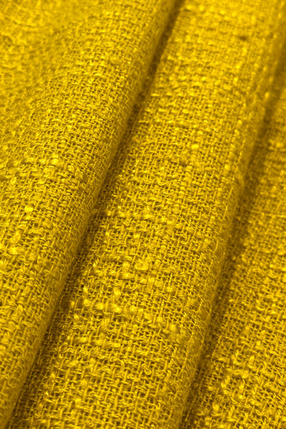 Close-up of textured yellow fabric