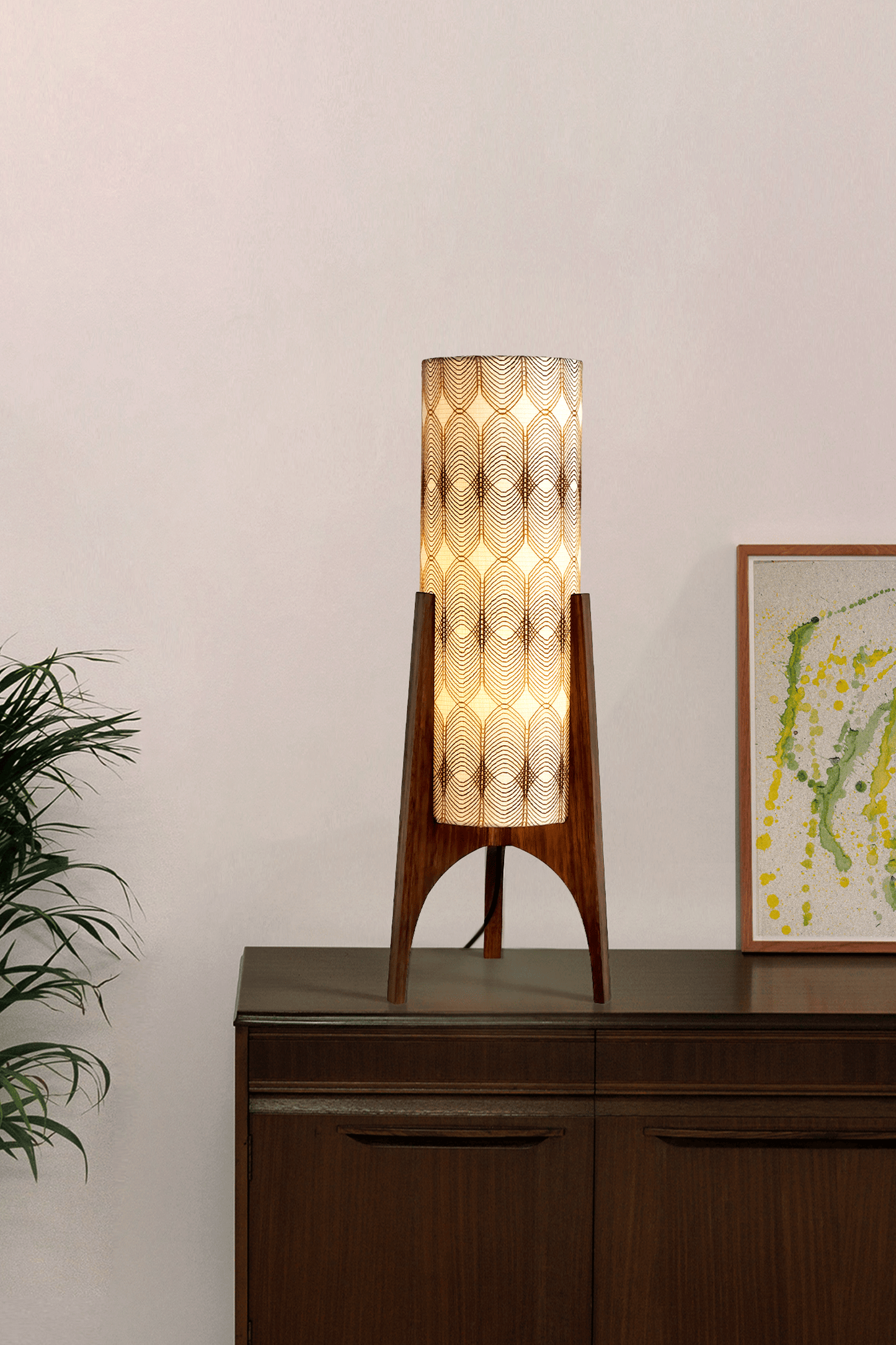 Noa - Archie Rocket Table lamp with a vintage woven fabric shade on a wooden cabinet against a white wall.