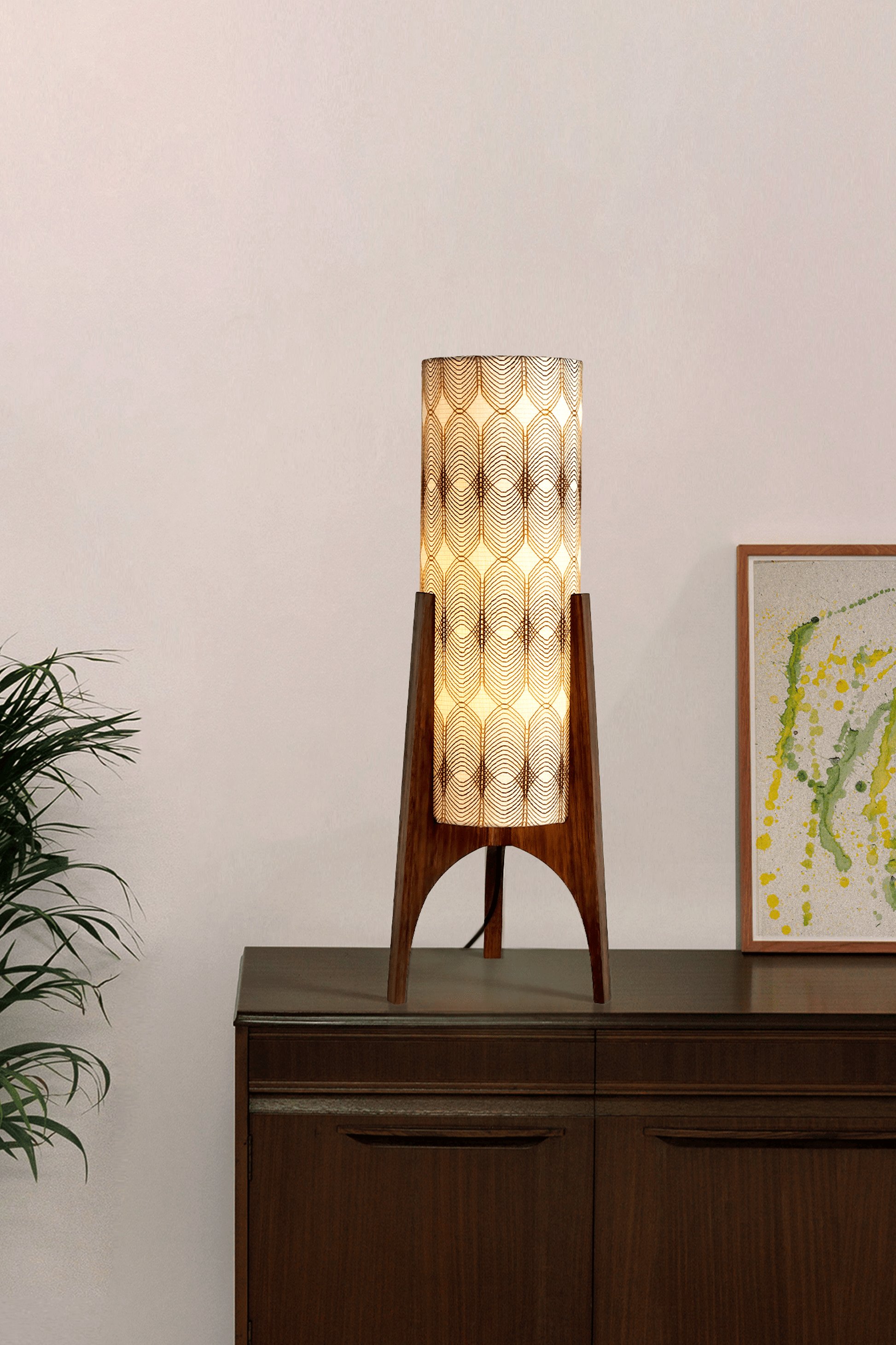 Noa - Archie Rocket Table lamp with a vintage woven fabric shade on a wooden cabinet against a white wall.