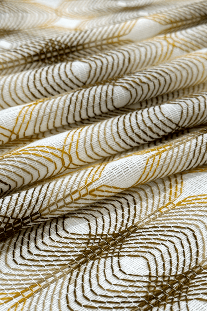 Close-up of textured fabric with gold and white pattern