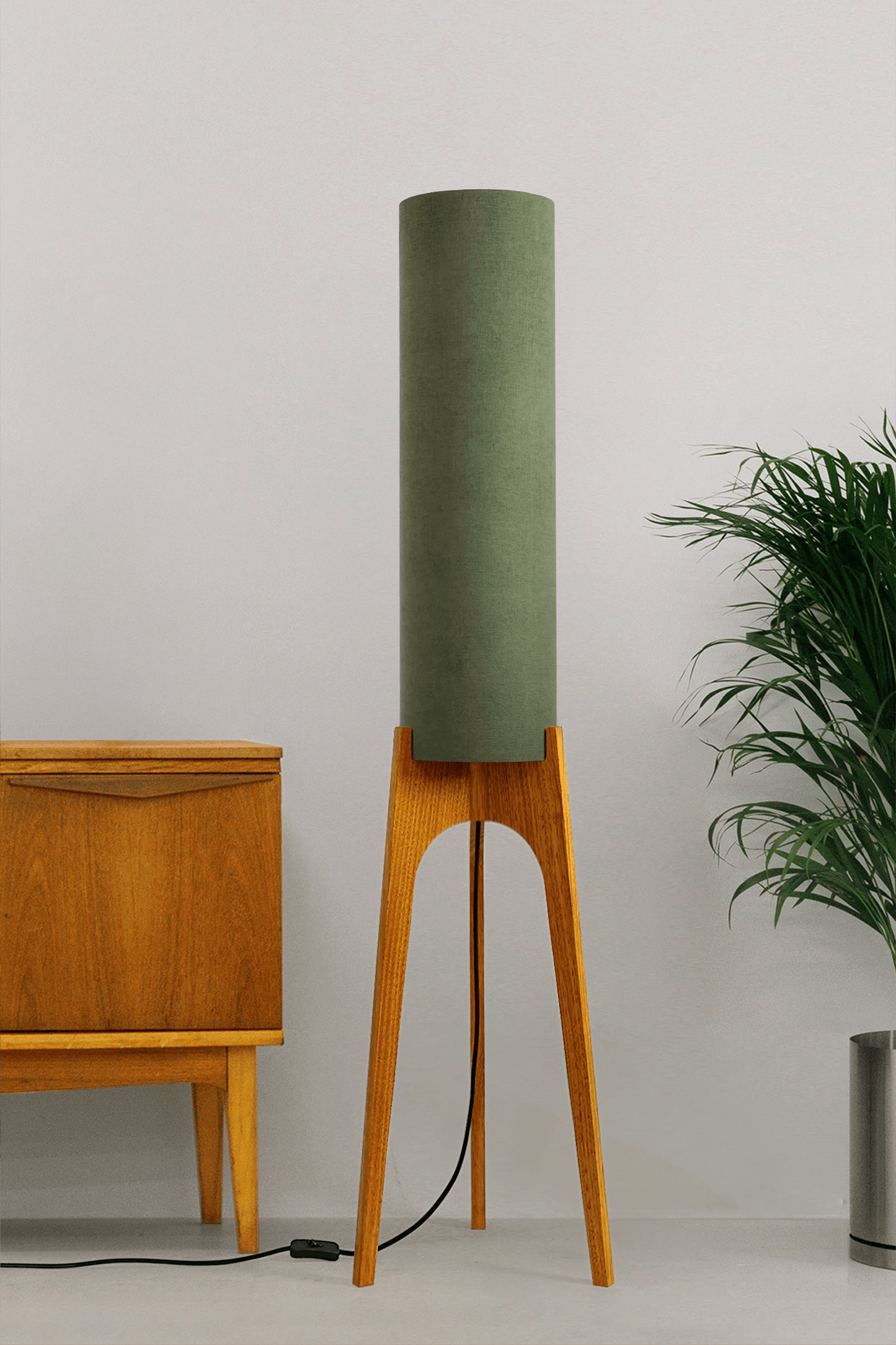 Handmade wooden Rocket Floor Lamp with cylindrical lampshade in Olive and wooden base in a mid-century room setting