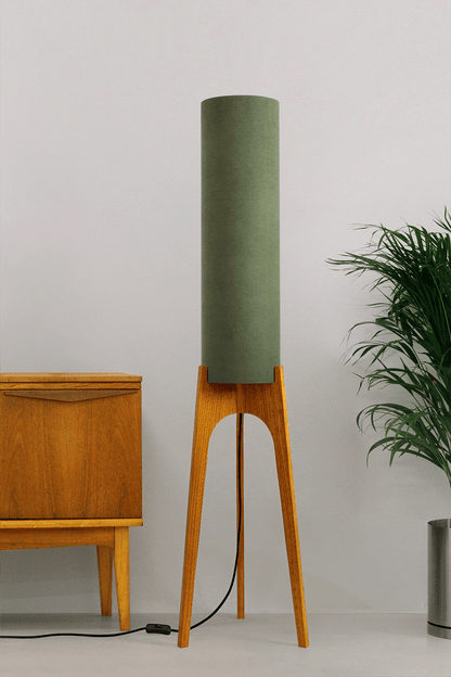 Handmade wooden Rocket Floor Lamp with cylindrical lampshade in Olive and wooden base in a mid-century room setting