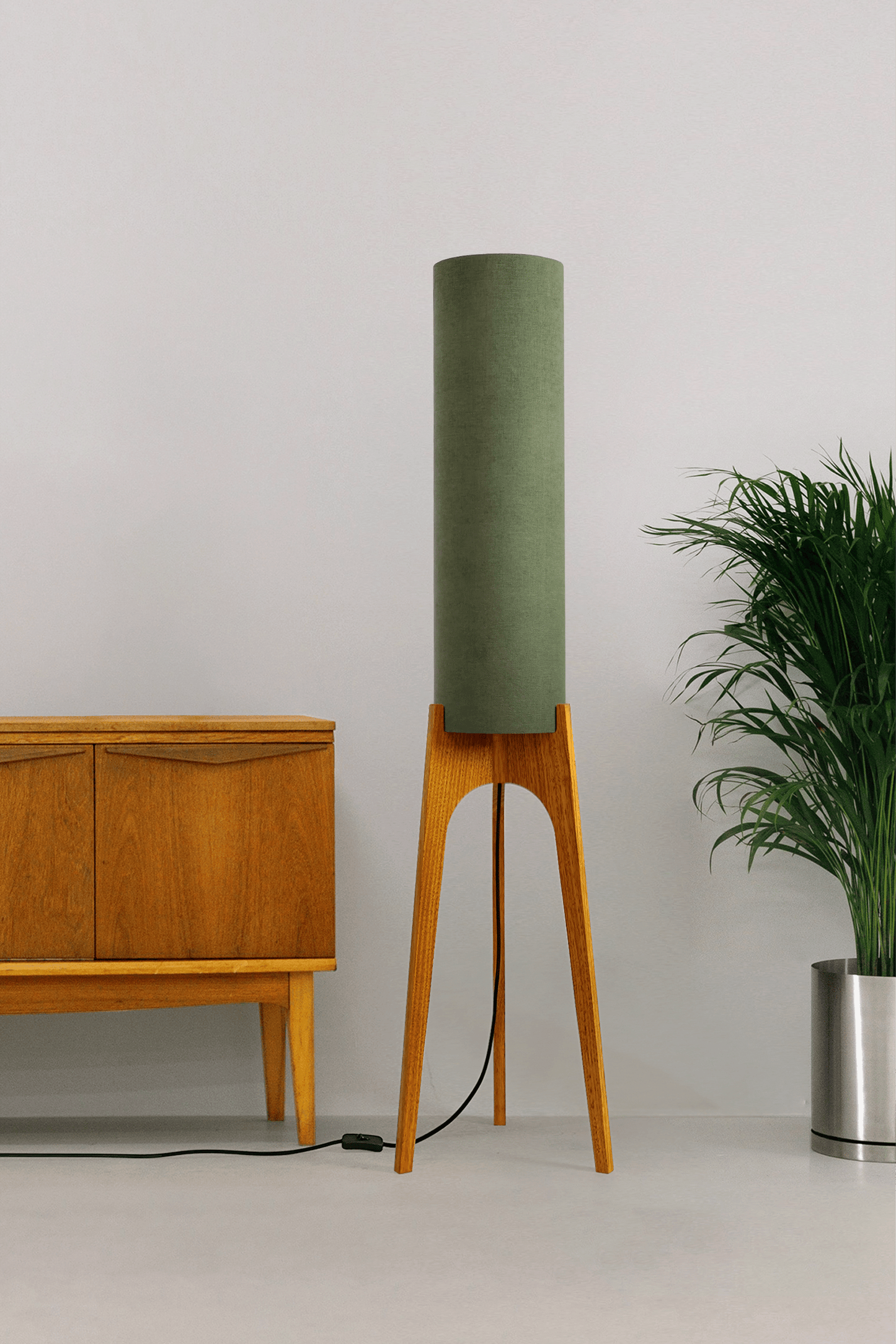 Handmade wooden Rocket Floor Lamp with cylindrical lampshade in Olive and wooden base in a mid-century room setting