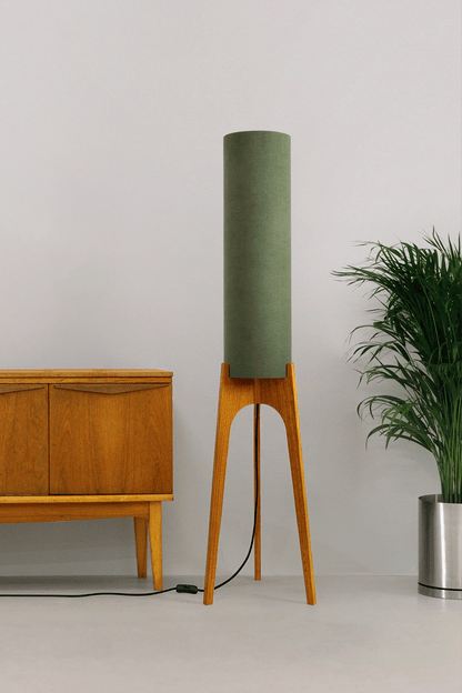 Handmade wooden Rocket Floor Lamp with cylindrical lampshade in Olive and wooden base in a mid-century room setting