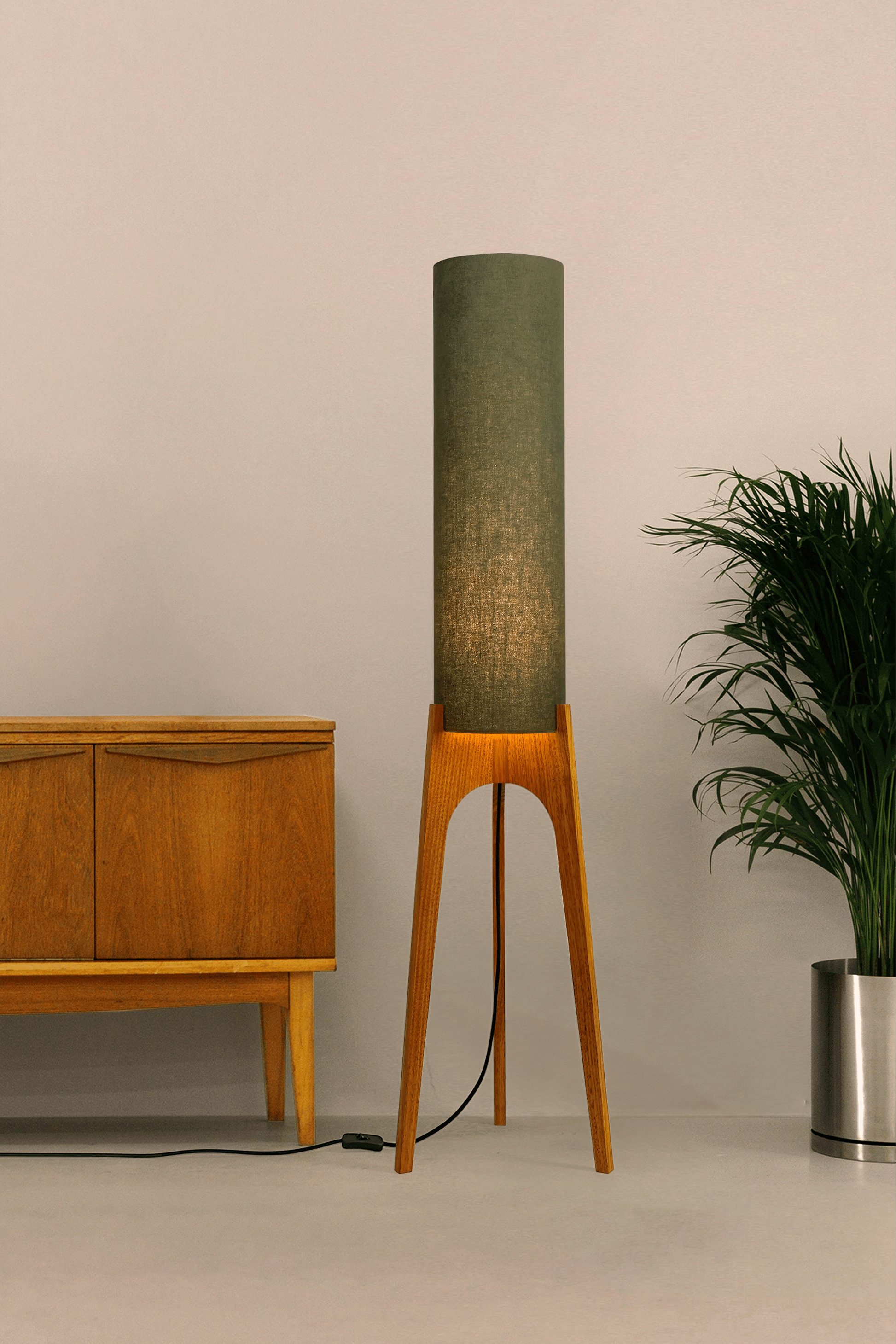 Handmade wooden Rocket Floor Lamp with cylindrical lampshade in Olive and wooden base in a mid-century room setting