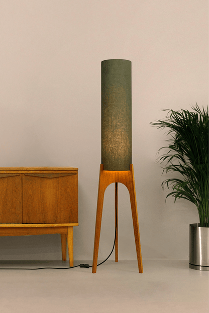 Handmade wooden Rocket Floor Lamp with cylindrical lampshade in Olive and wooden base in a mid-century room setting
