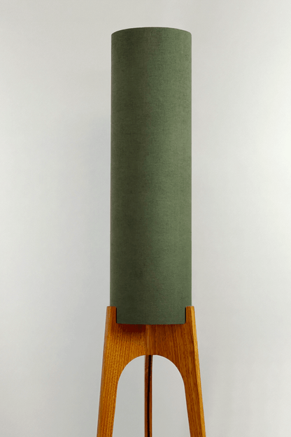 Handmade wooden Rocket Floor Lamp with cylindrical lampshade in Olive and wooden base in a mid-century room setting