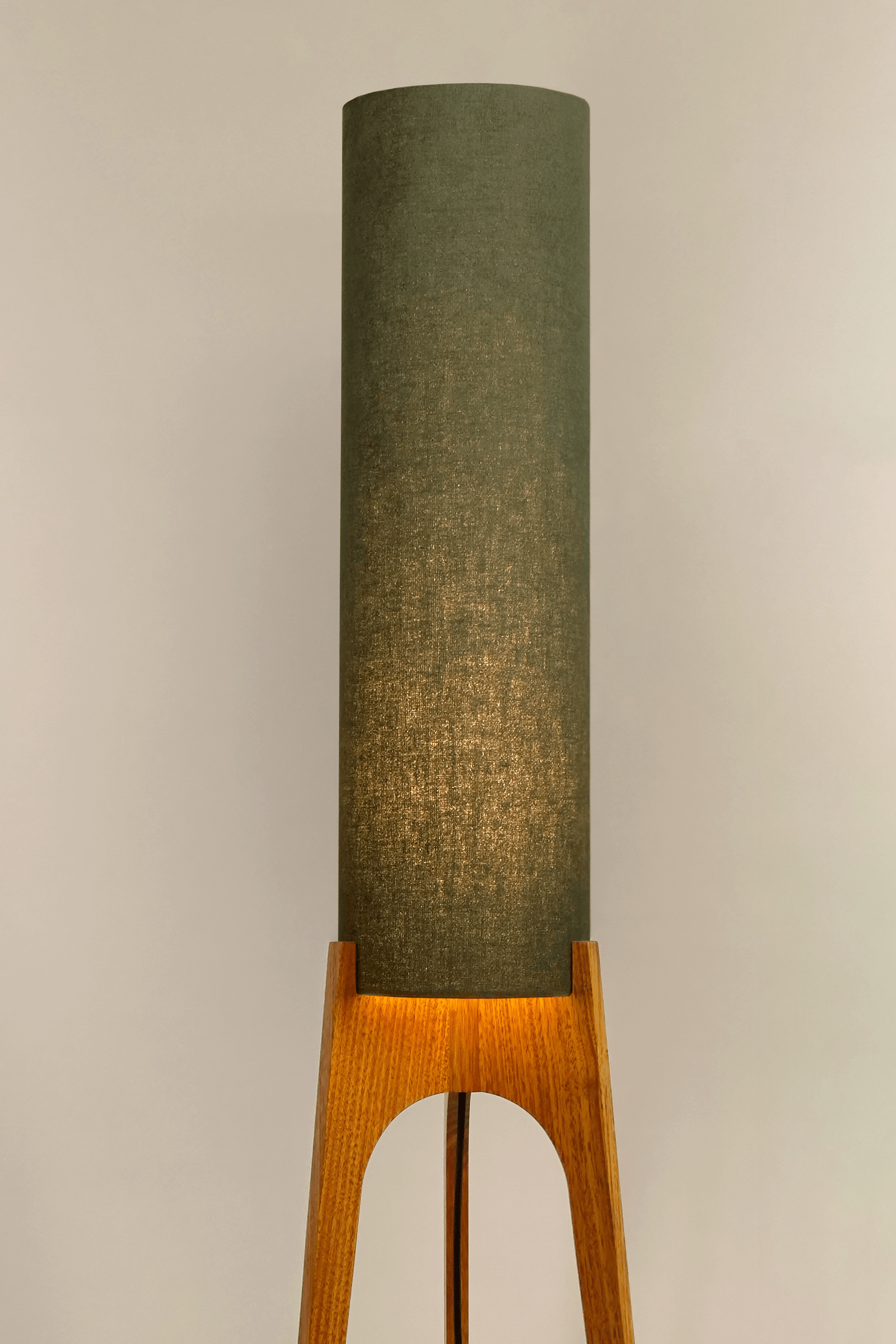 Handmade wooden Rocket Floor Lamp with cylindrical lampshade in Olive and wooden base in a mid-century room setting